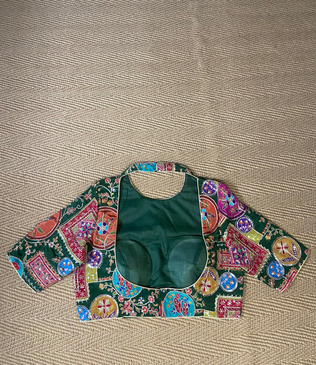 Green blouse with multi color print and highlighted with threadwork