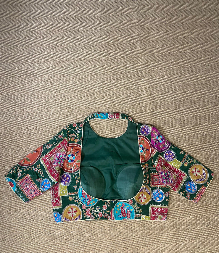 Green blouse with multi color print and highlighted with threadwork