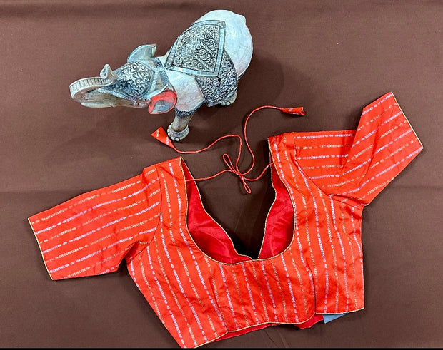 Orange silk blouse with gold and silver weave