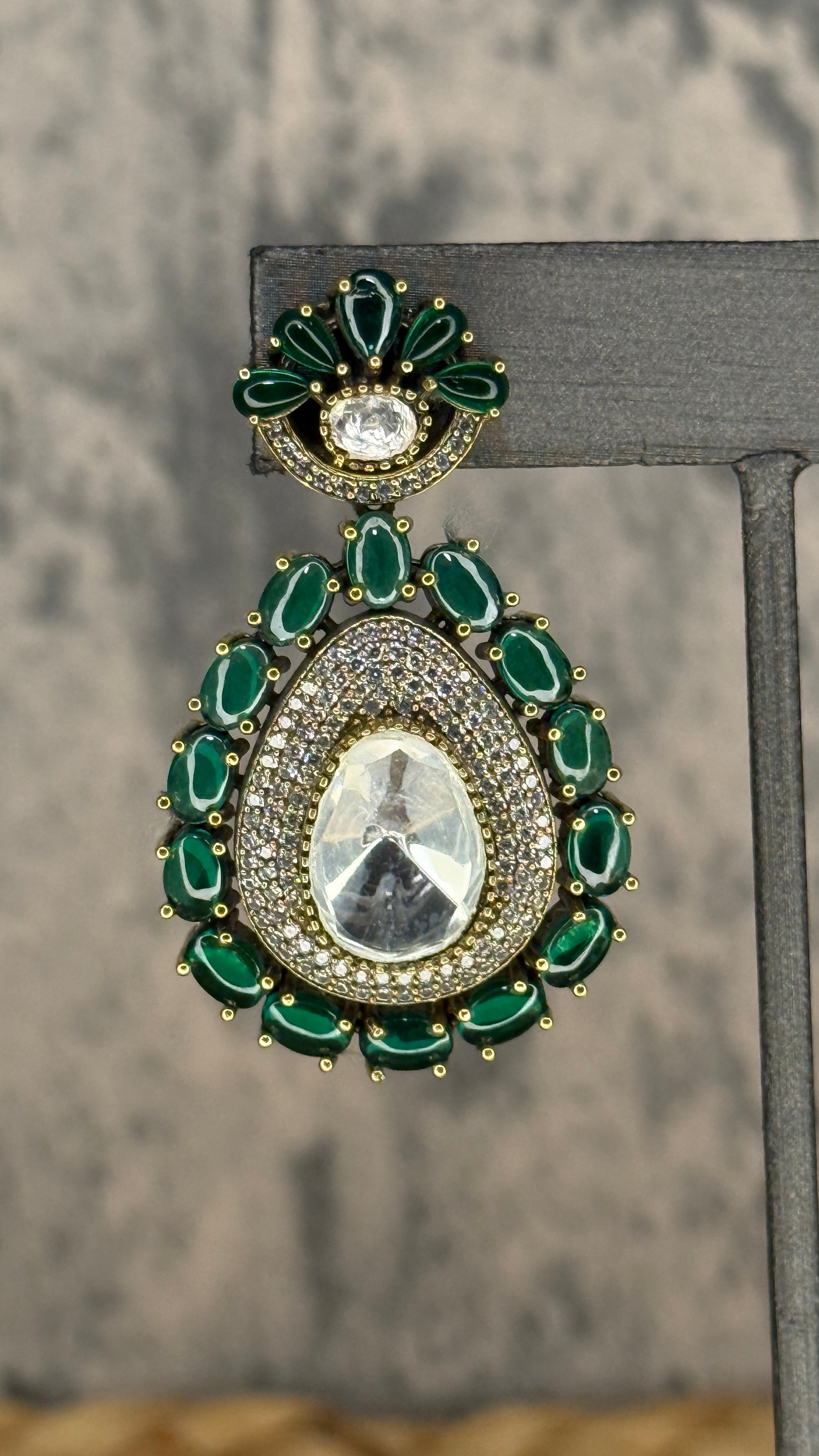 Earring with green stones