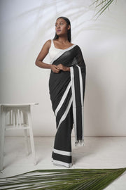 Black mulcotton saree with white satin border