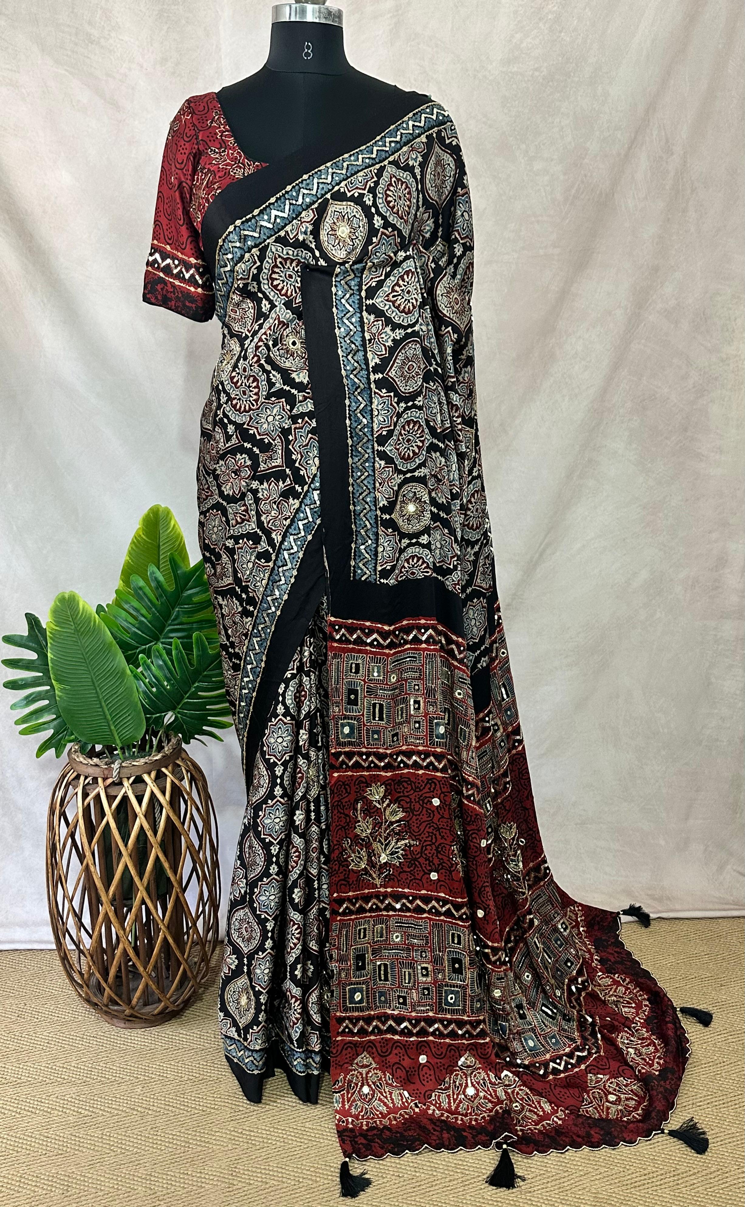 Designer Ajrakh modal silk saree with bead and mirroer handwork, stitched blouse