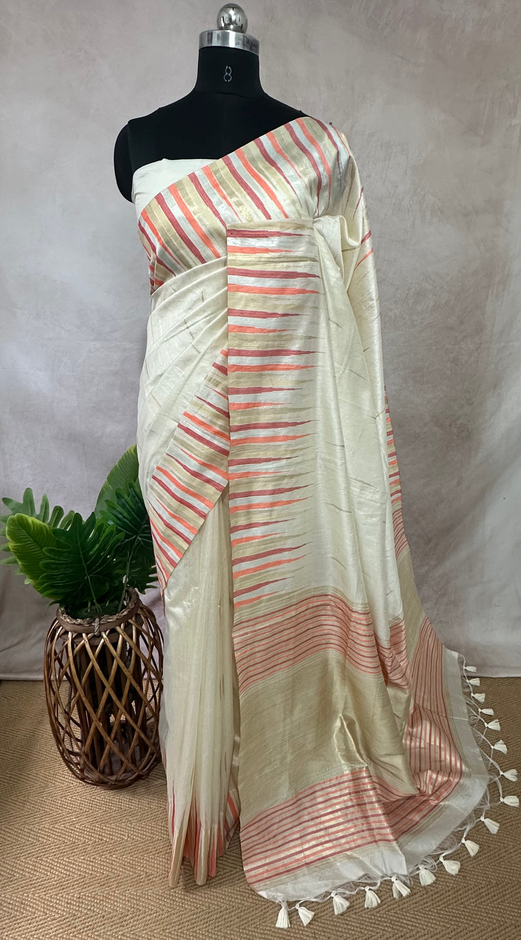 Off white Semi silk saree with peach and gold temple border