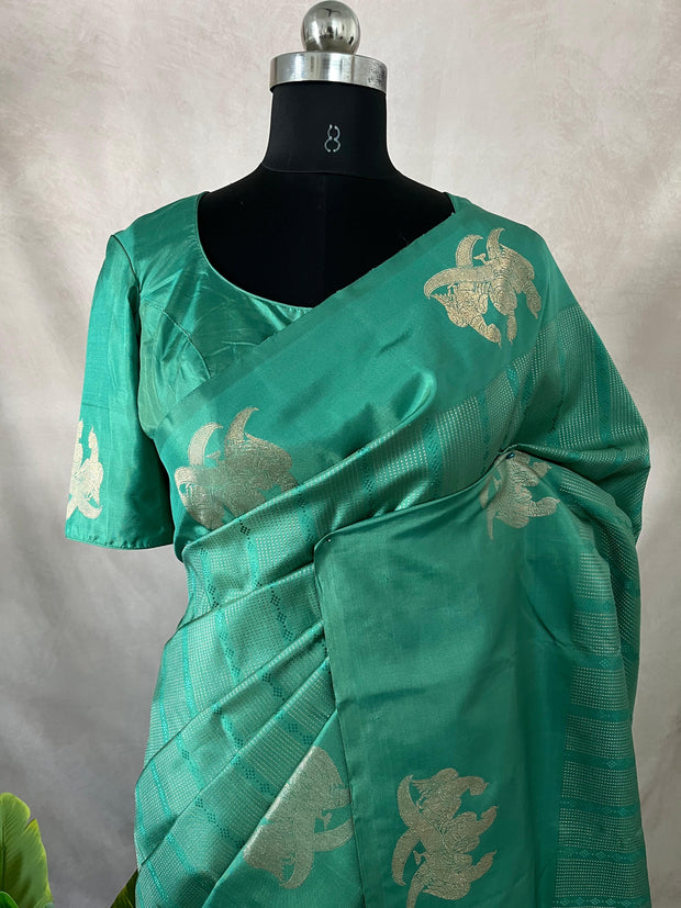 Light peacock Green Kanchivaram saree with stitched blouse