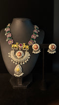Dual tone necklace with blue and pink stones and earring