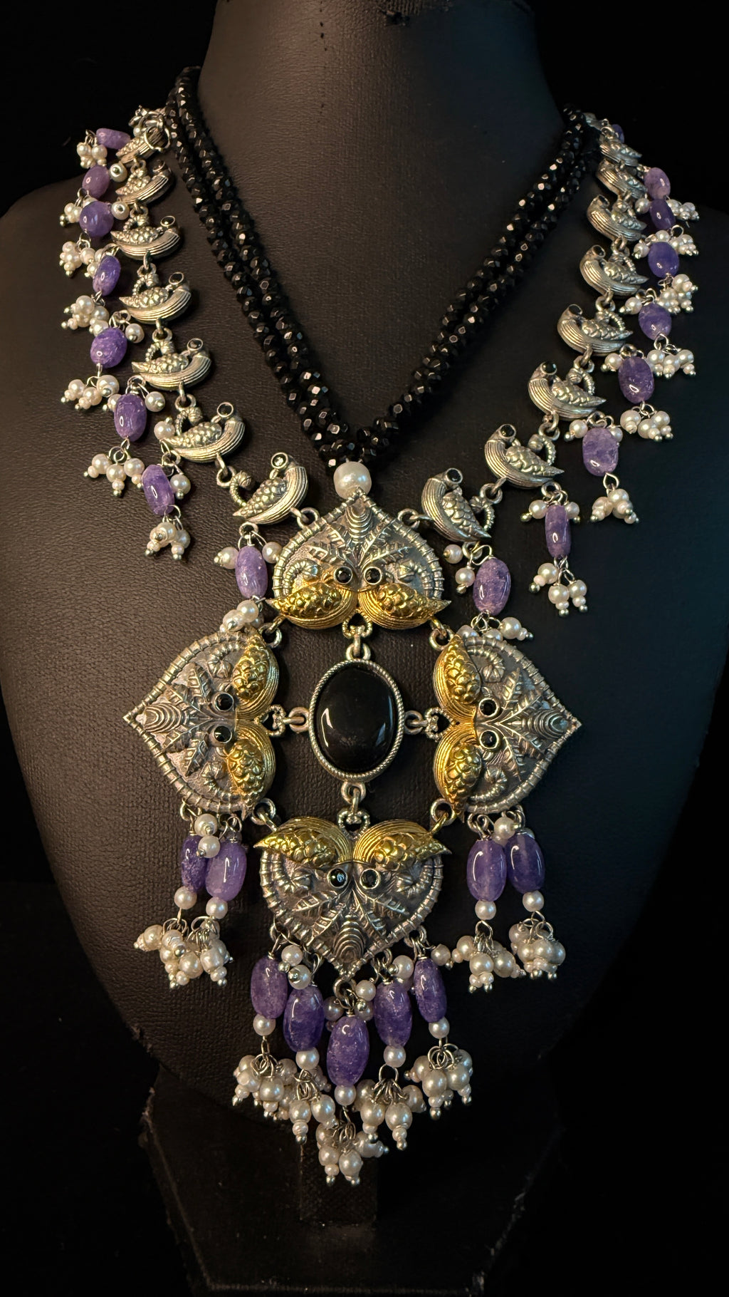 Dual tone necklace with purple stone