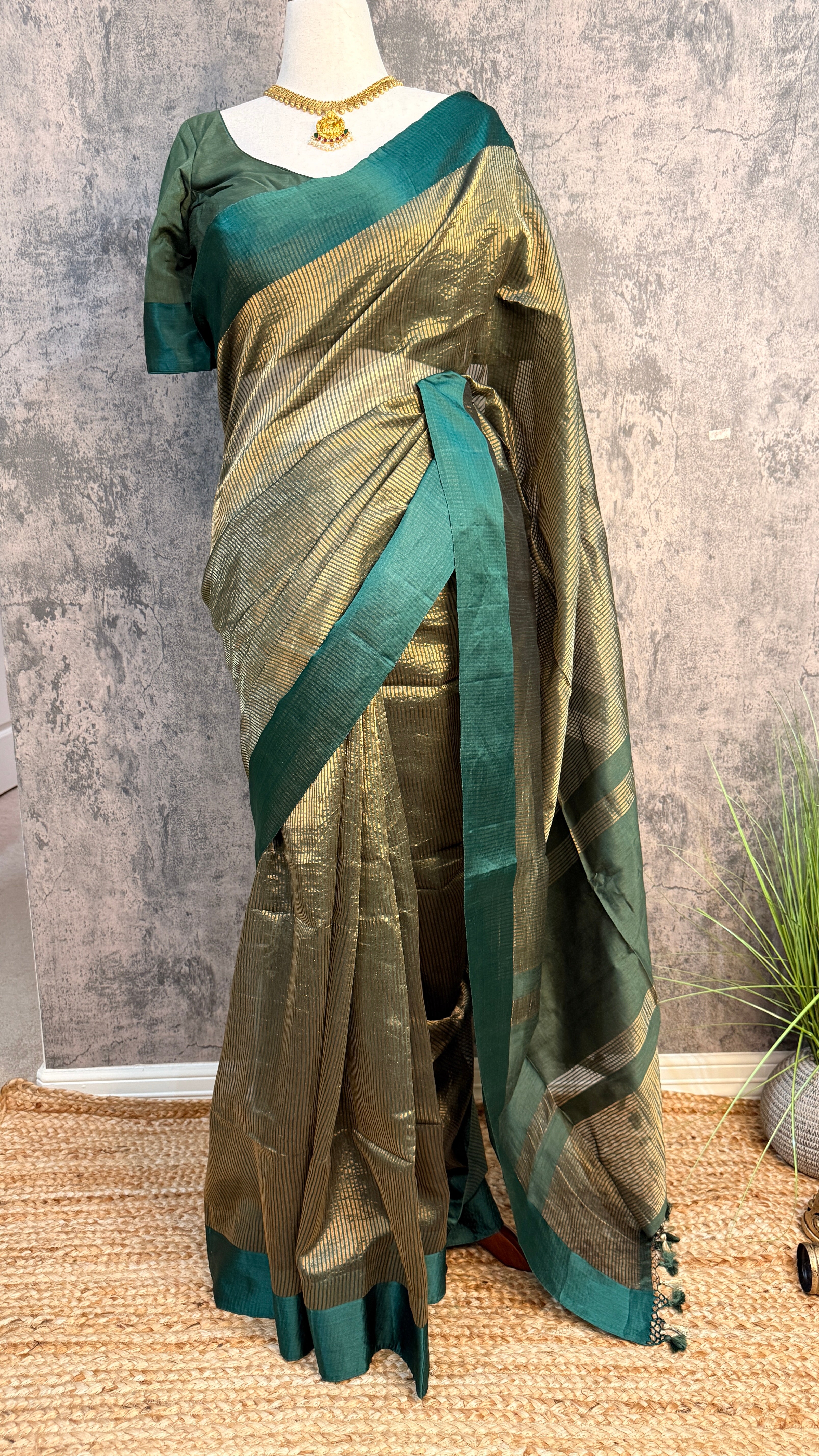 Dark green stripe tissue silk saree with stitched blouse