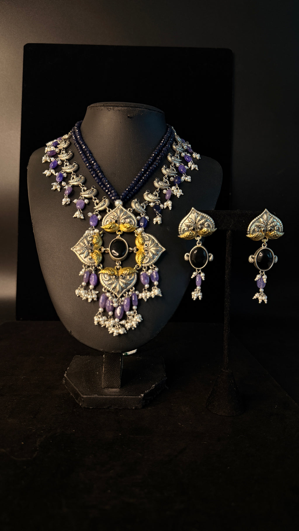 Dual tone necklace with purple stone