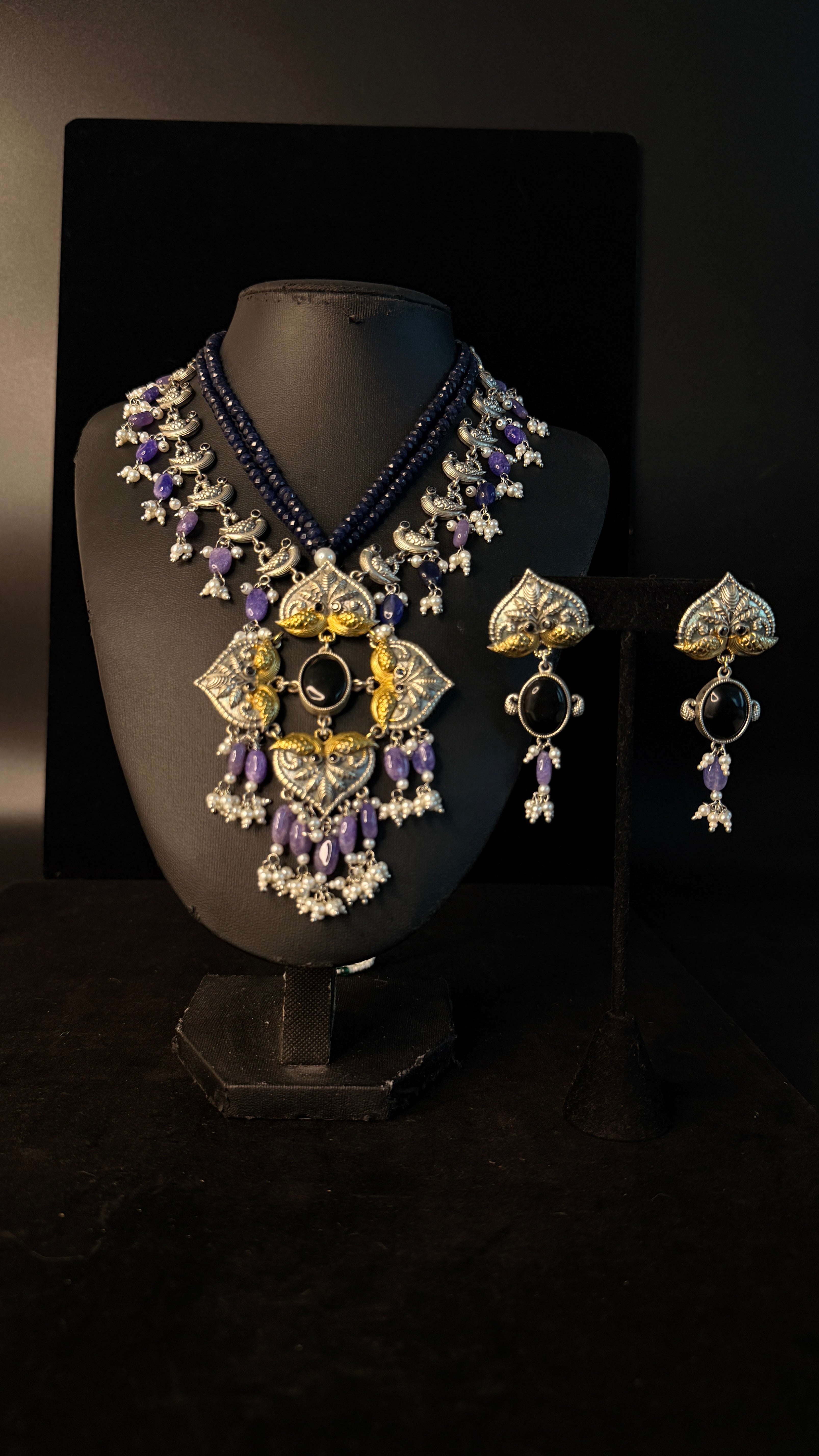 Dual tone necklace with purple stone
