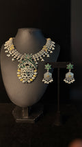 Dual tone necklace with green stones and earring