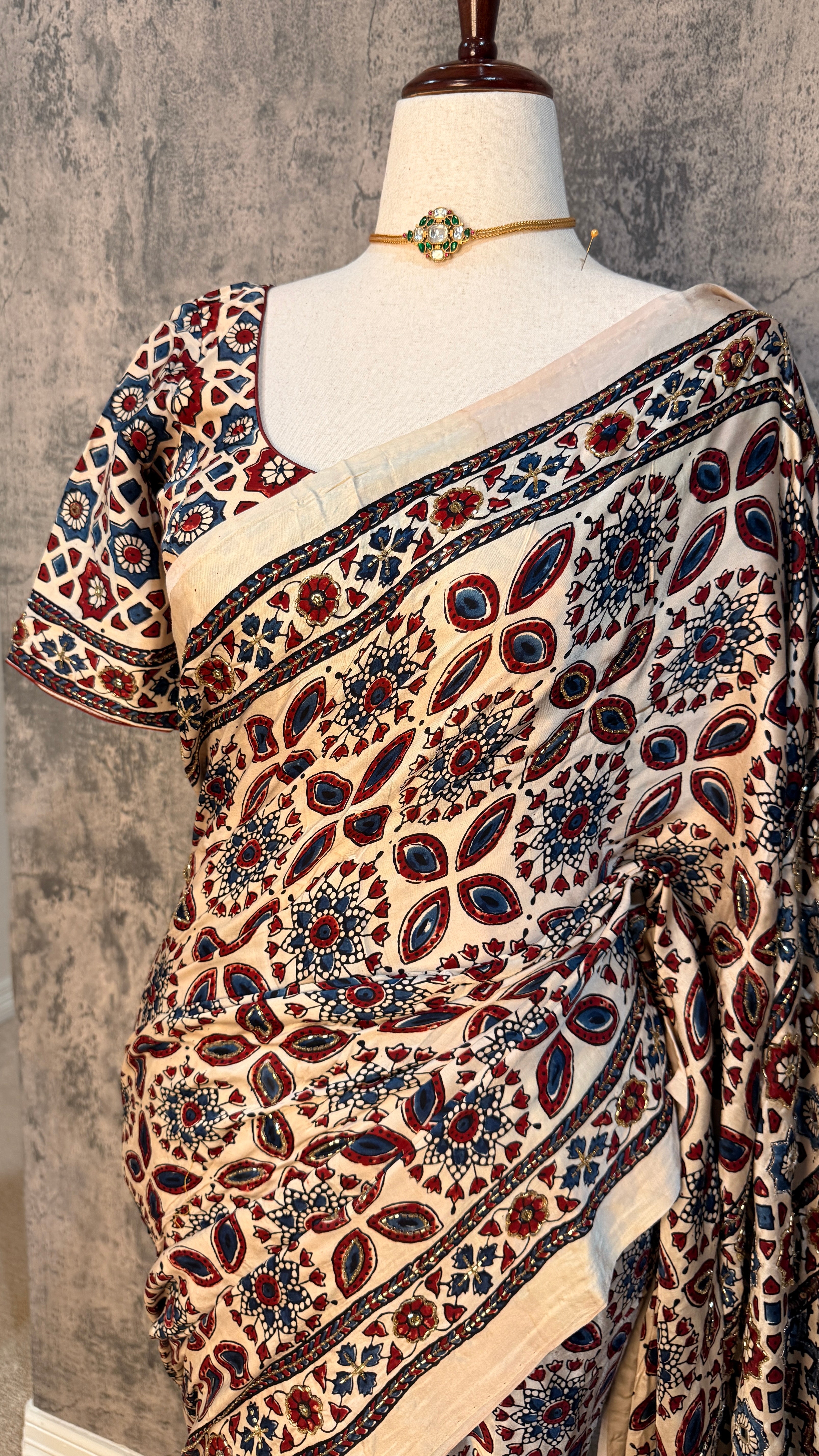 Modal silk saree with bead and mirror work , stitched blouse