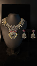 Dual tone necklace with blue and pink stones and earring