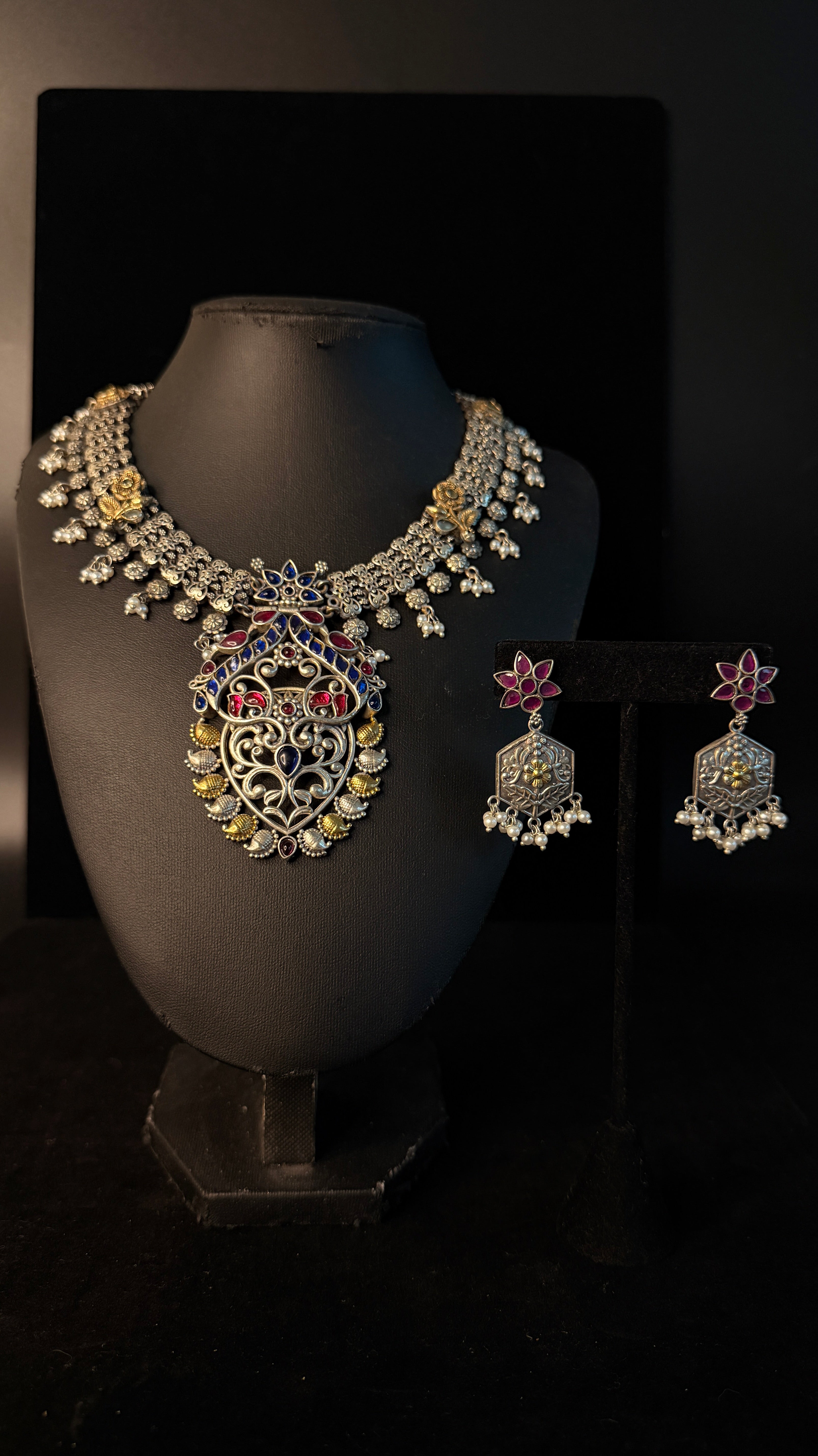 Dual tone necklace with blue and pink stones and earring