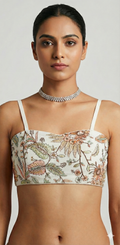 white sleveless blouse with embroidery