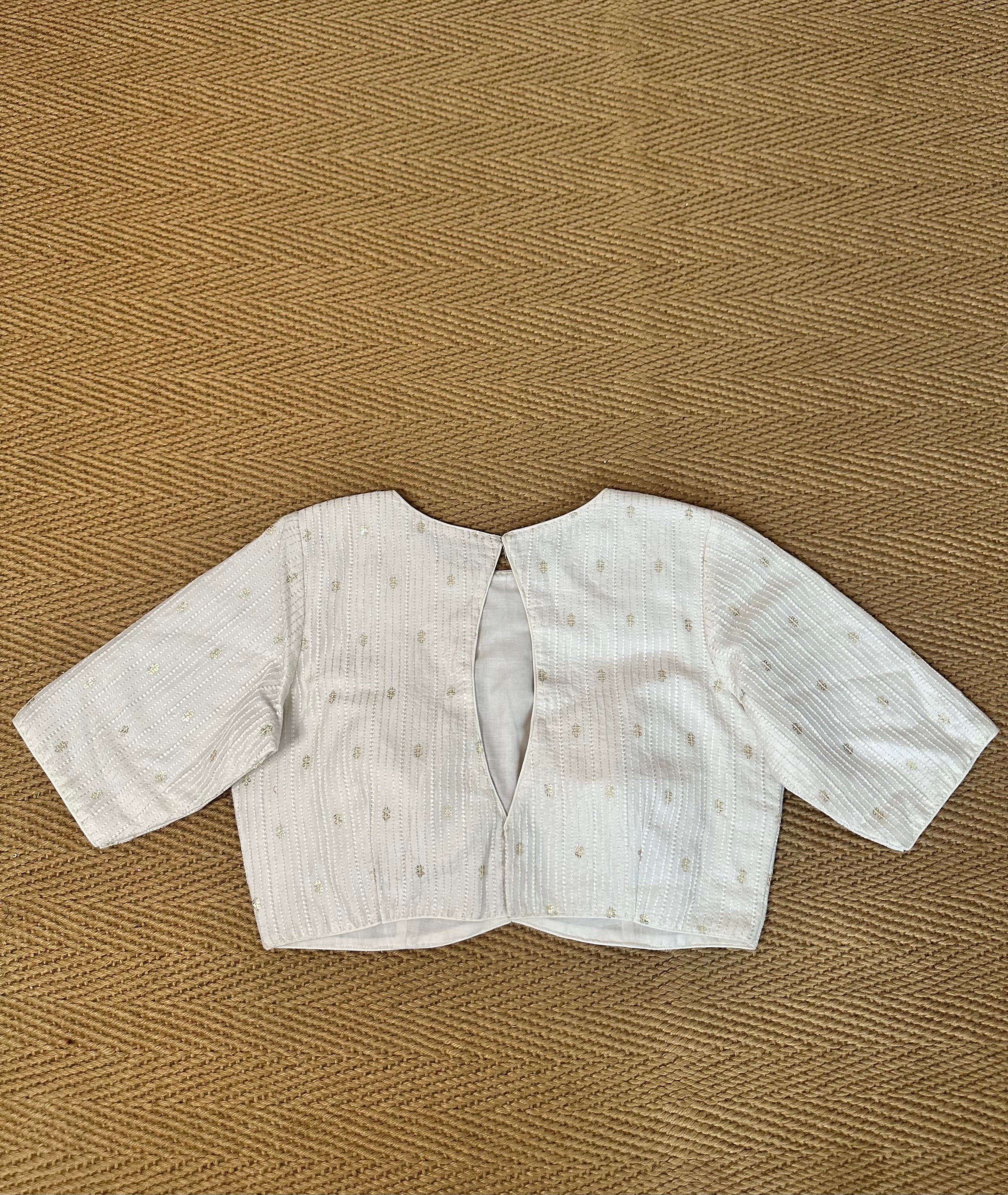 Off white silk blouse with sequins