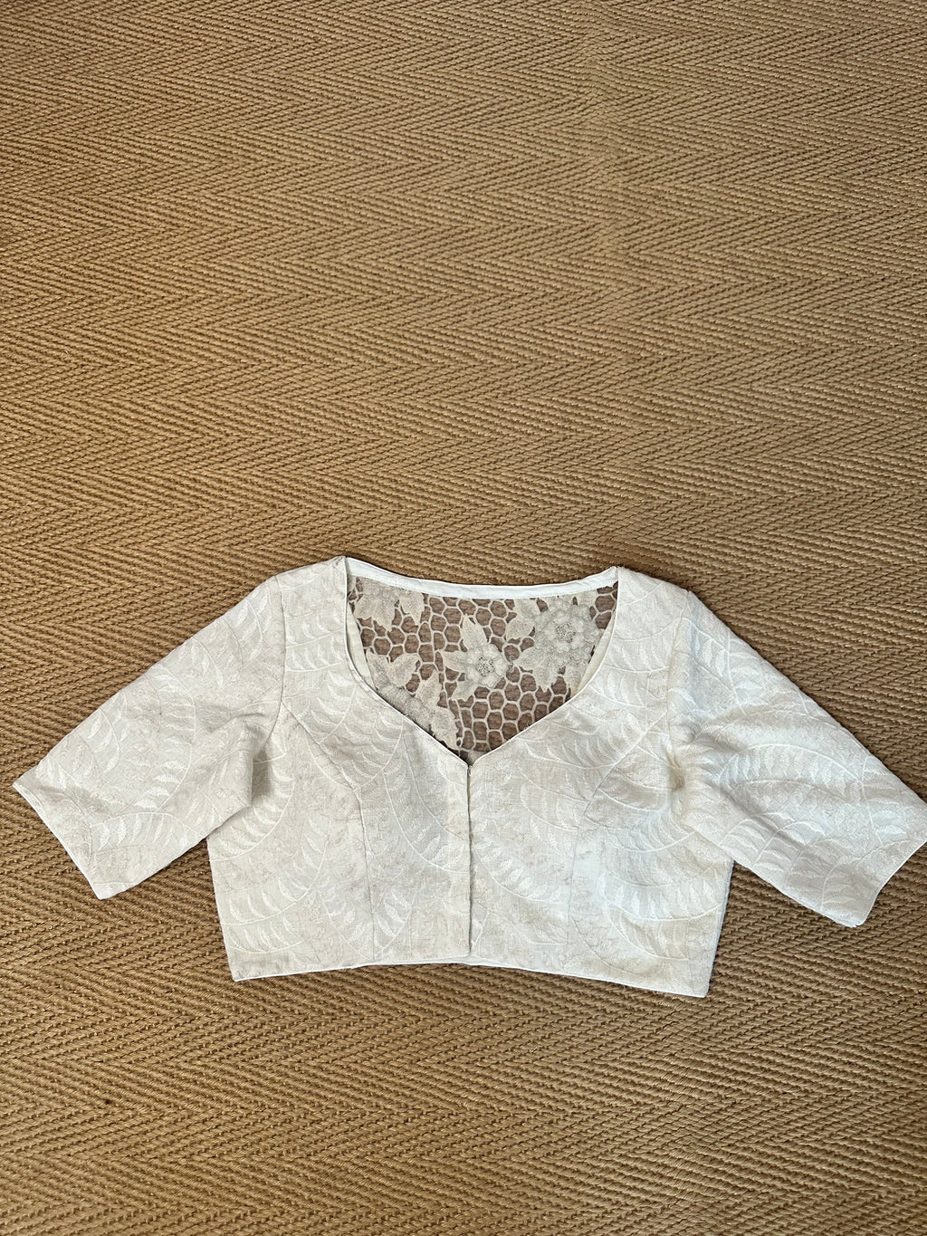 Off white linen blouse with cut work on the back
