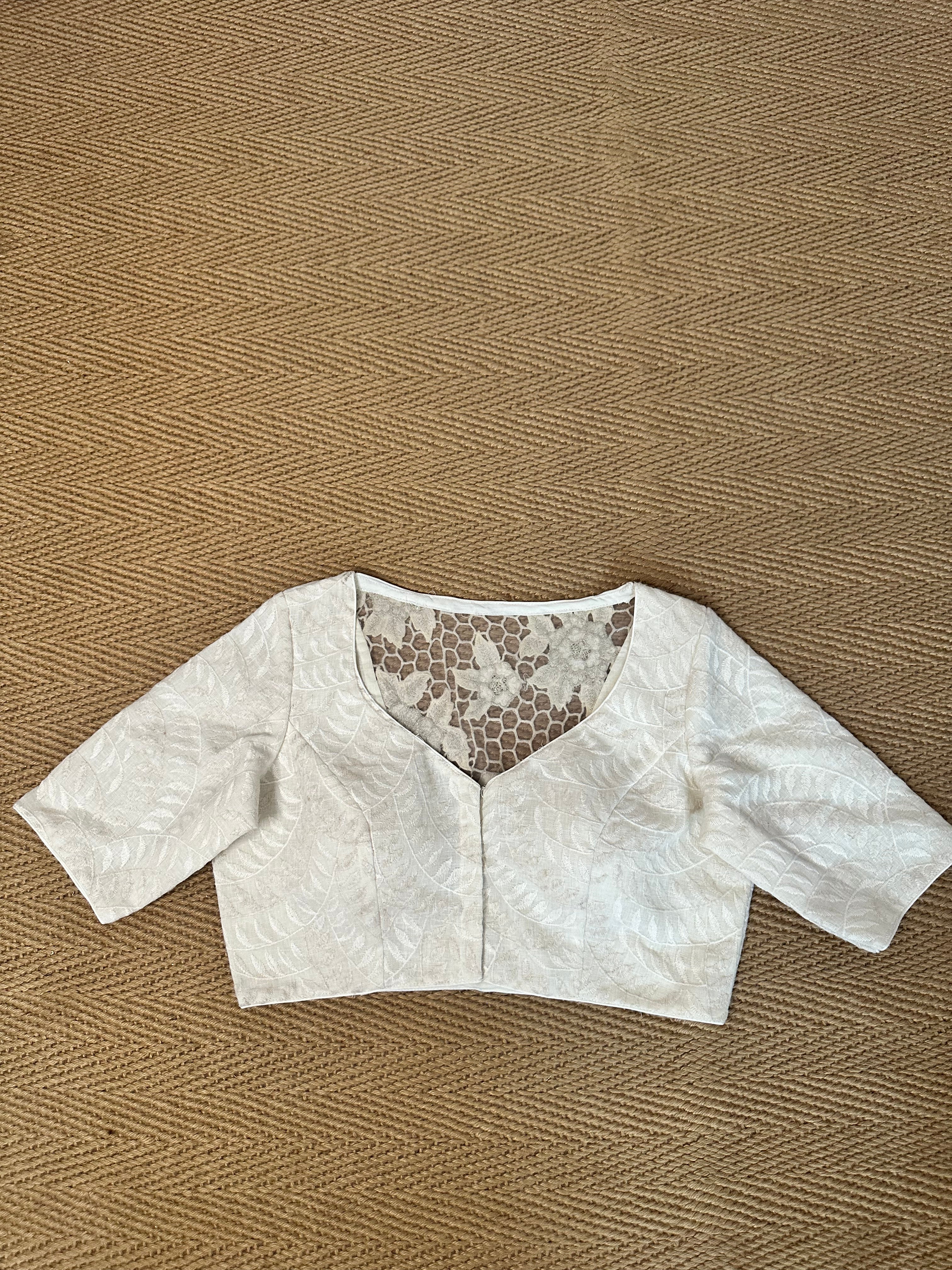 Off white linen blouse with cut work on the back