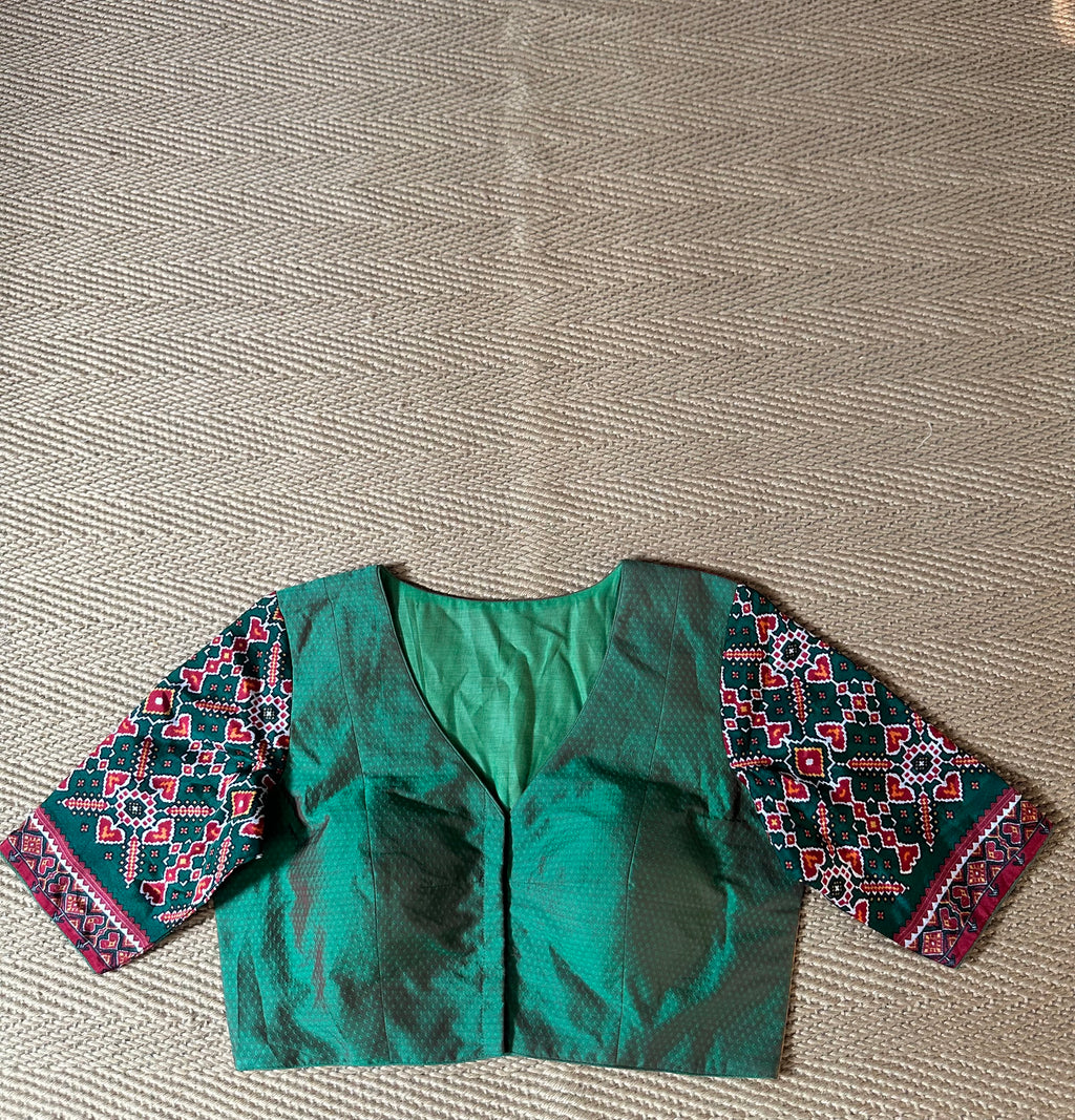 Green silk blouse