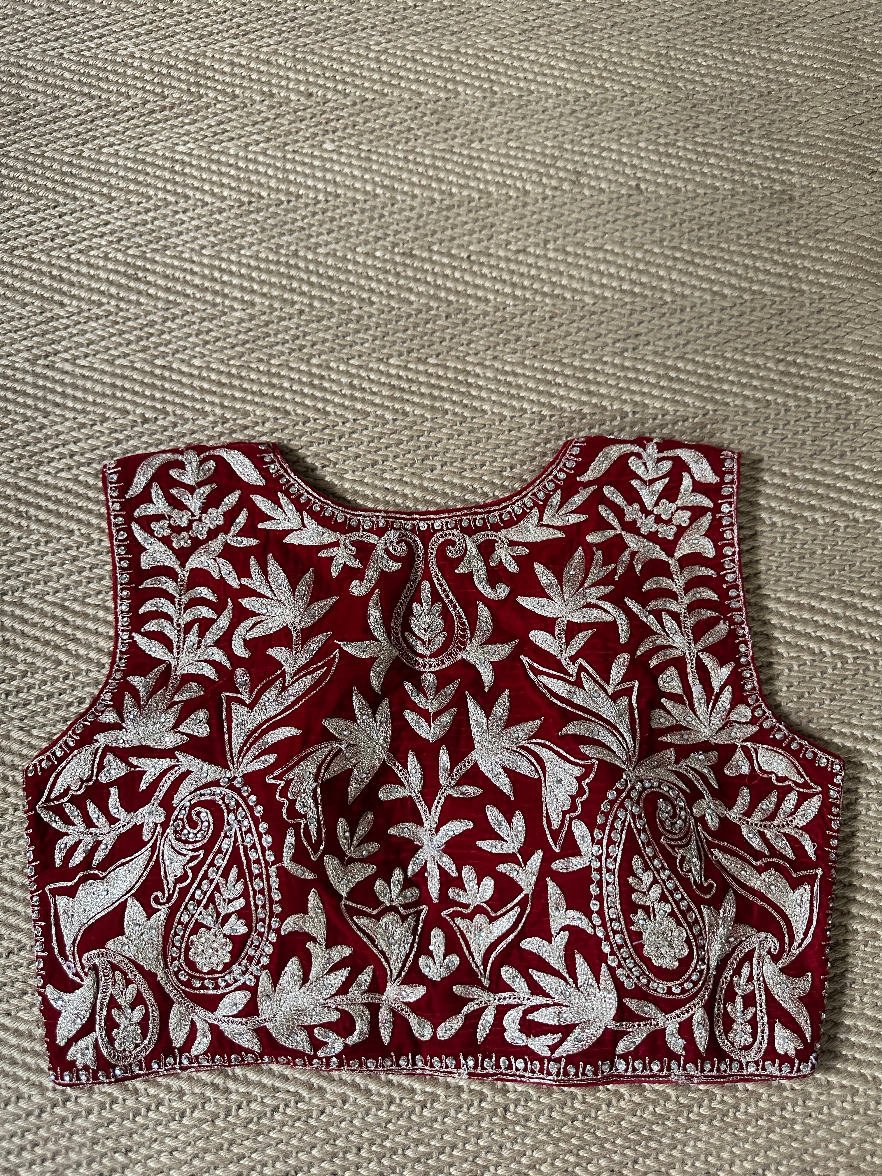 Red designer velvet sleeveless blouse