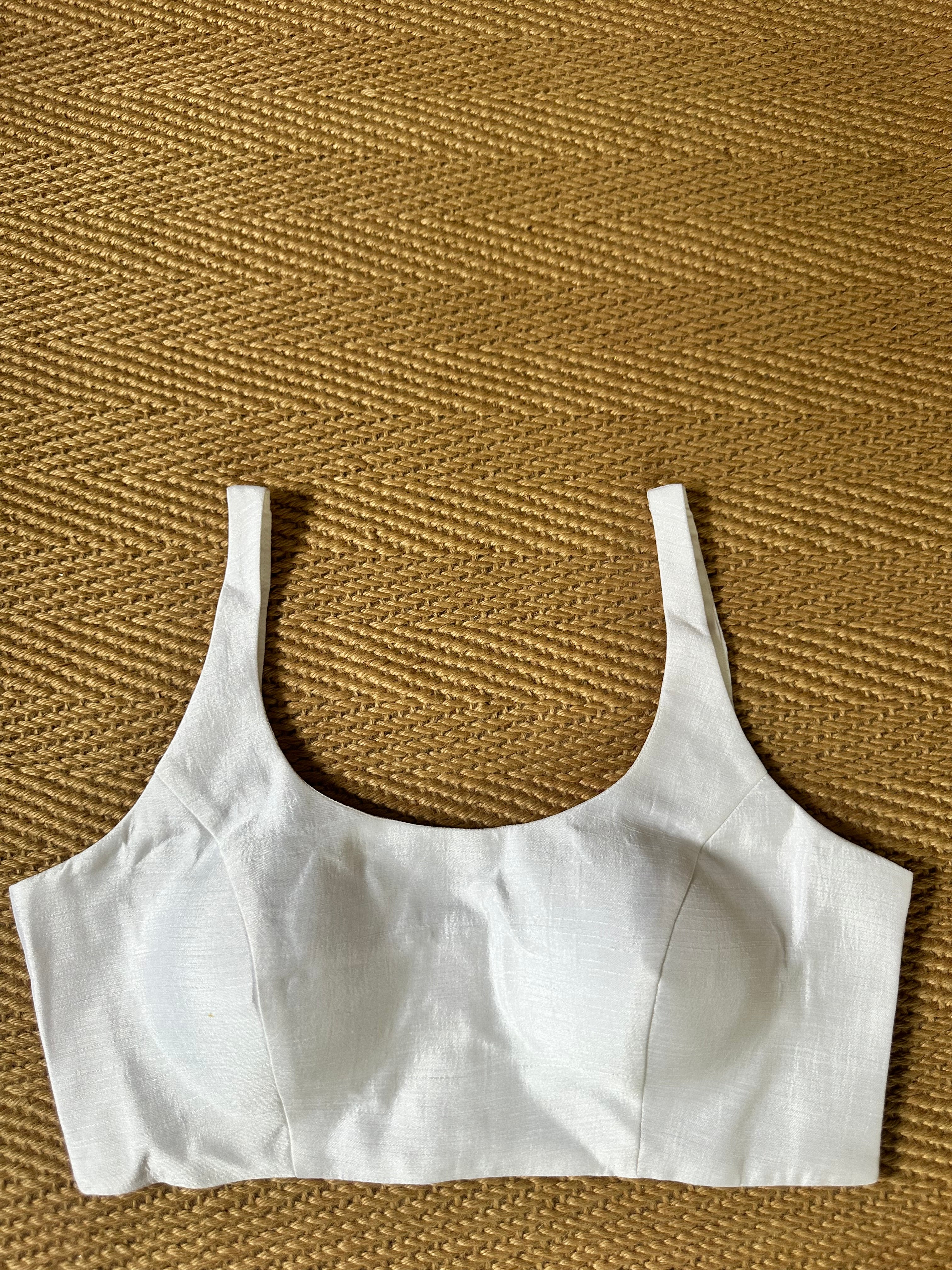 White sleeveless blouse