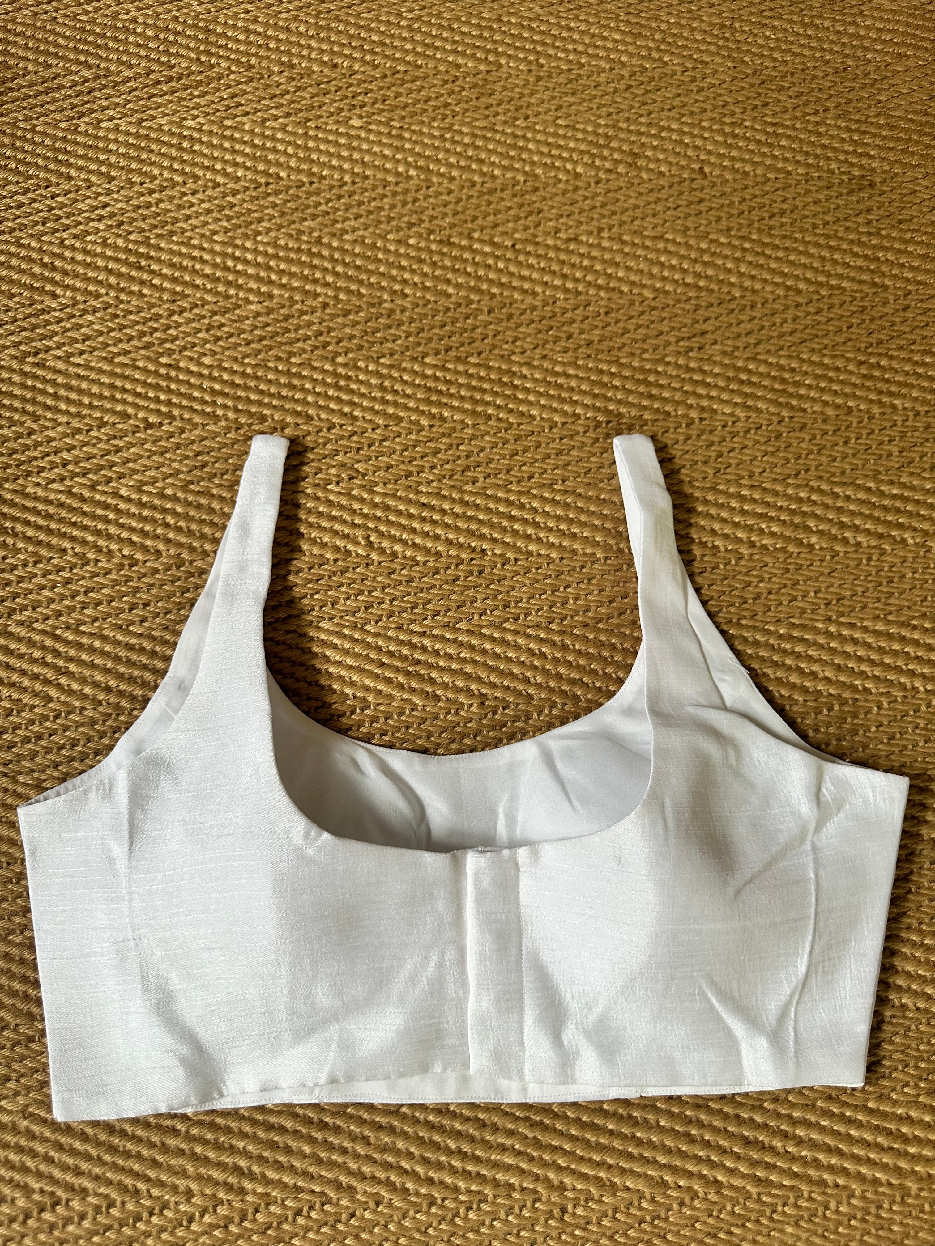 White sleeveless blouse