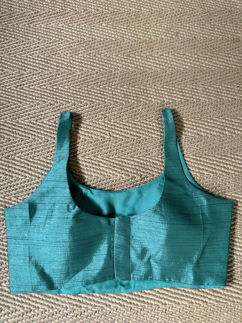 Dark sea green sleeveless blouse