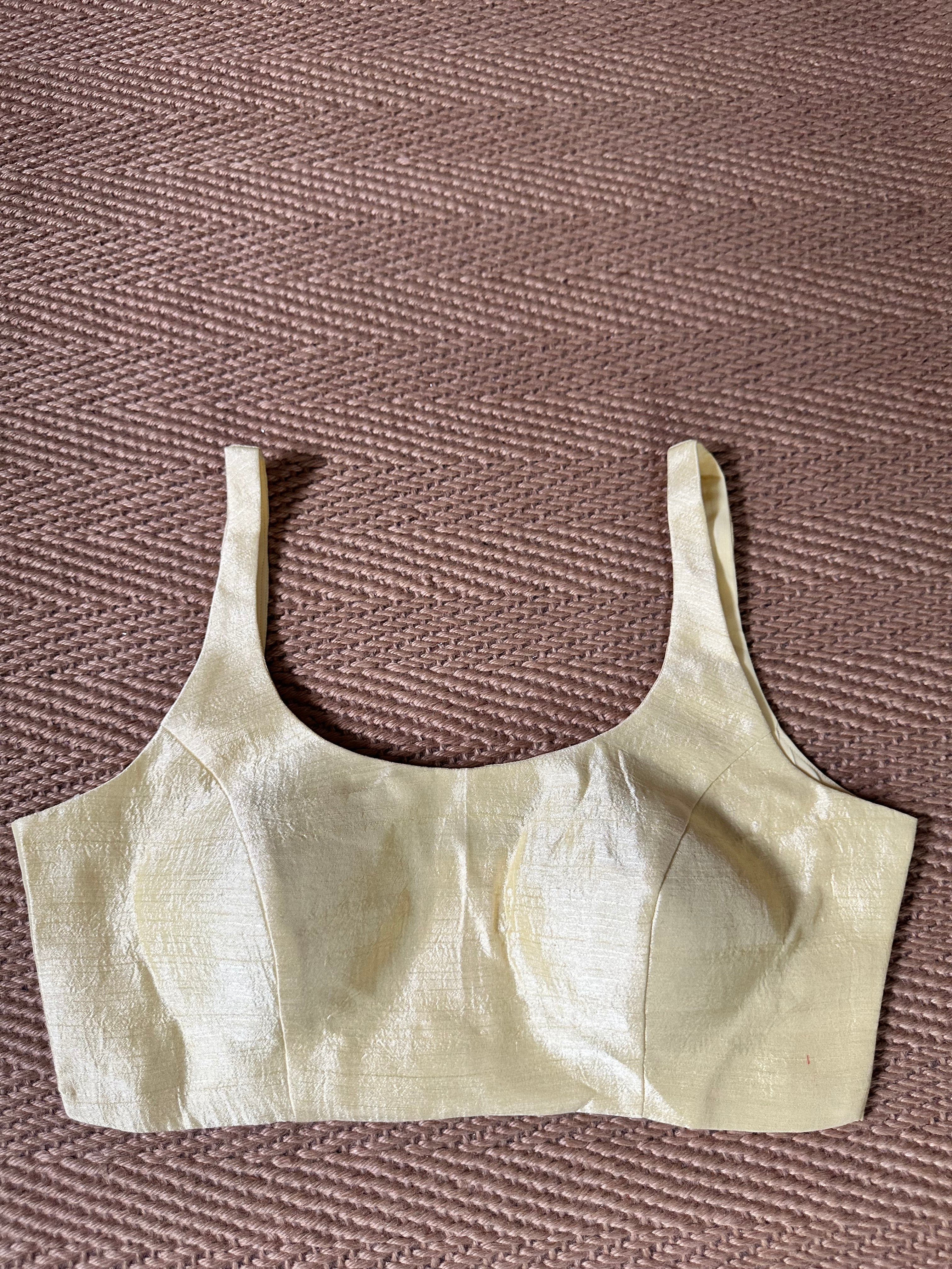 Light yellow sleeveless blouse