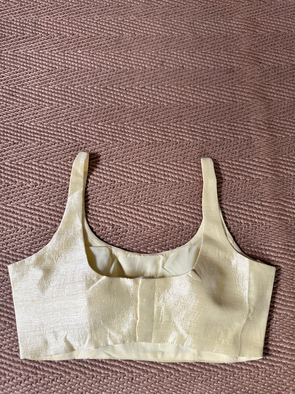 Light yellow sleeveless blouse