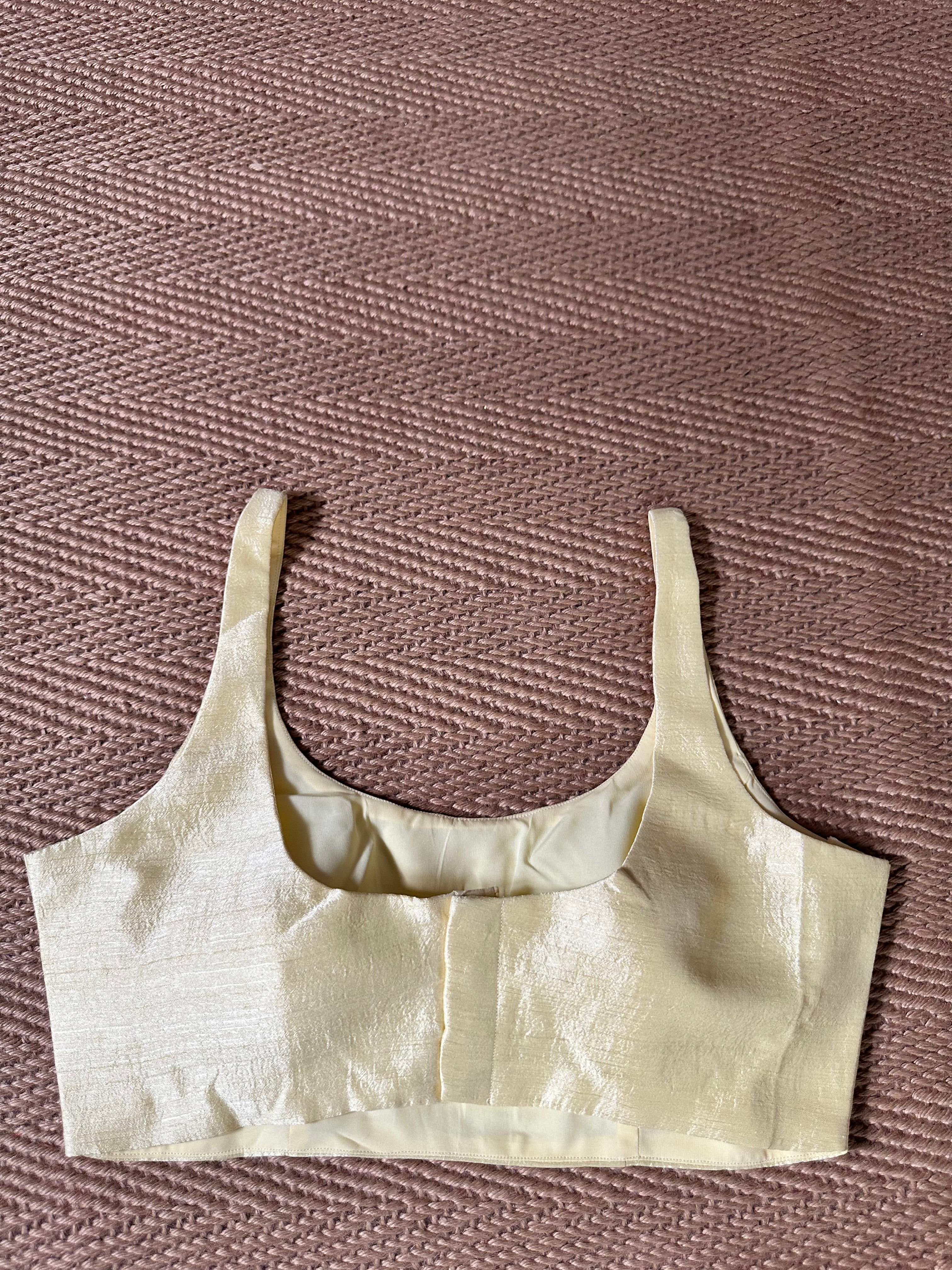 Light yellow sleeveless blouse