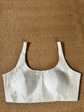 White sleeveless blouse