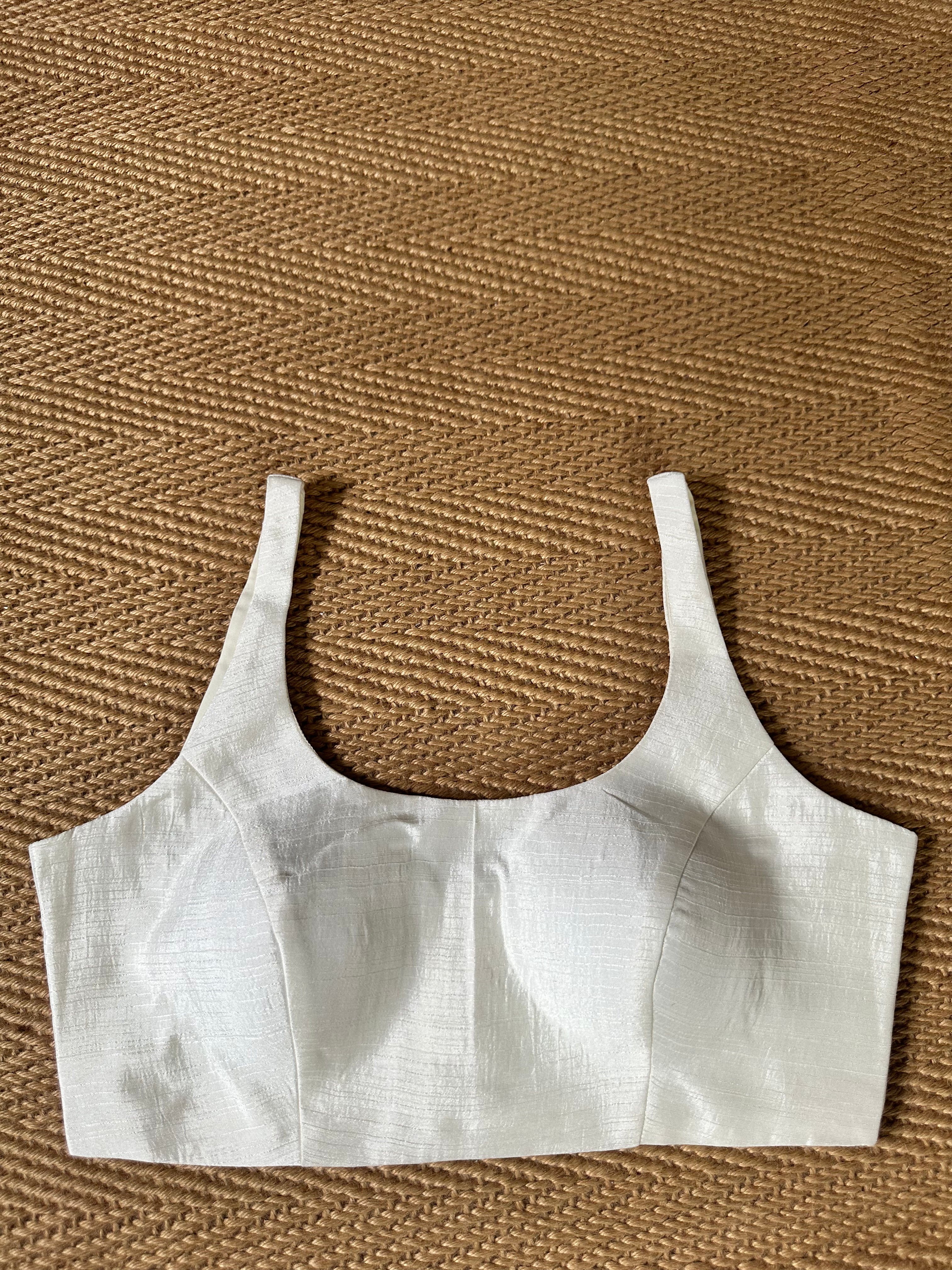 White sleeveless blouse