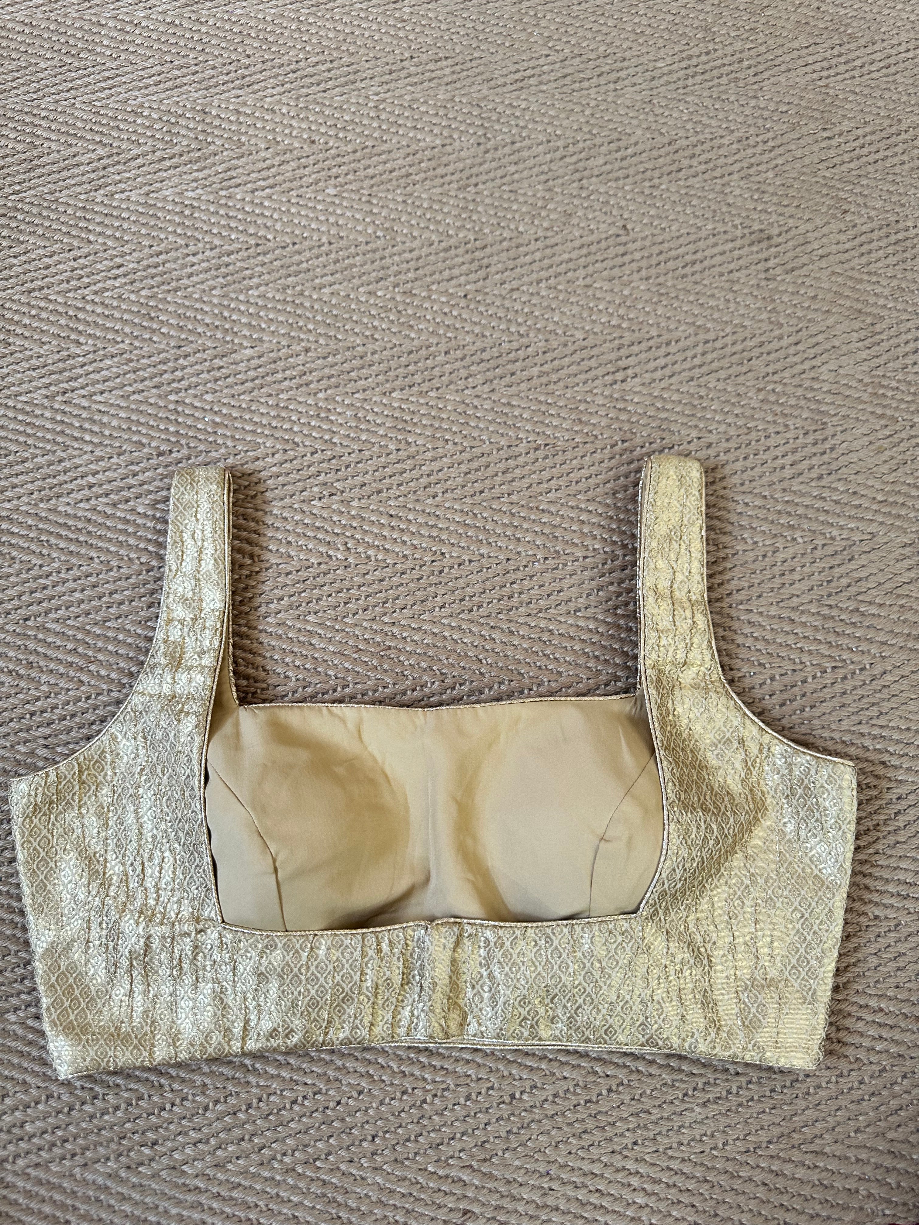 Gold brocade sleeveless blouse