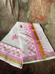 Set saree with pink print and gold border, and waved lined on the body