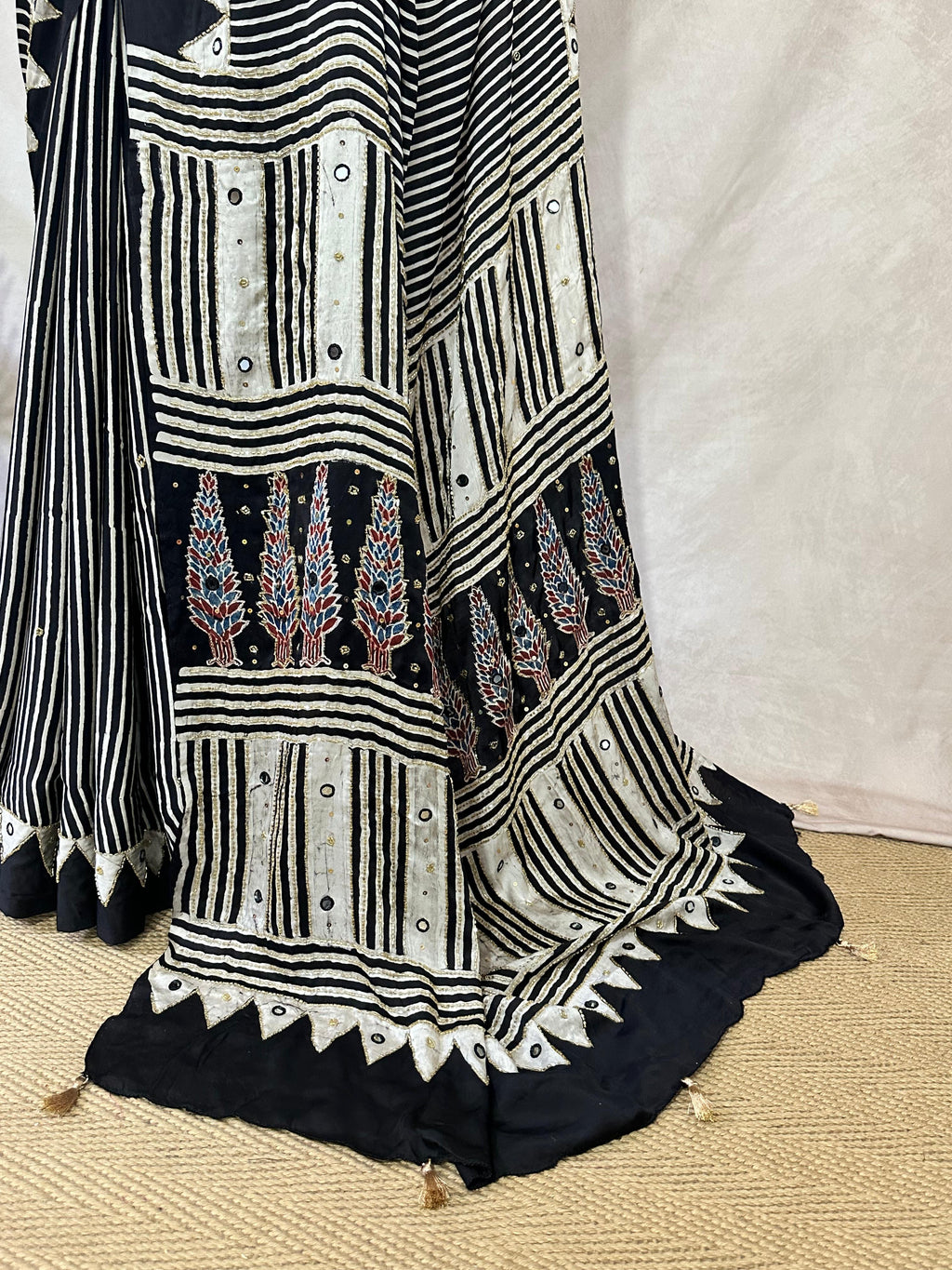 Designer Ajrakh modal silk saree with bead and mirroer handwork, stitched blouse