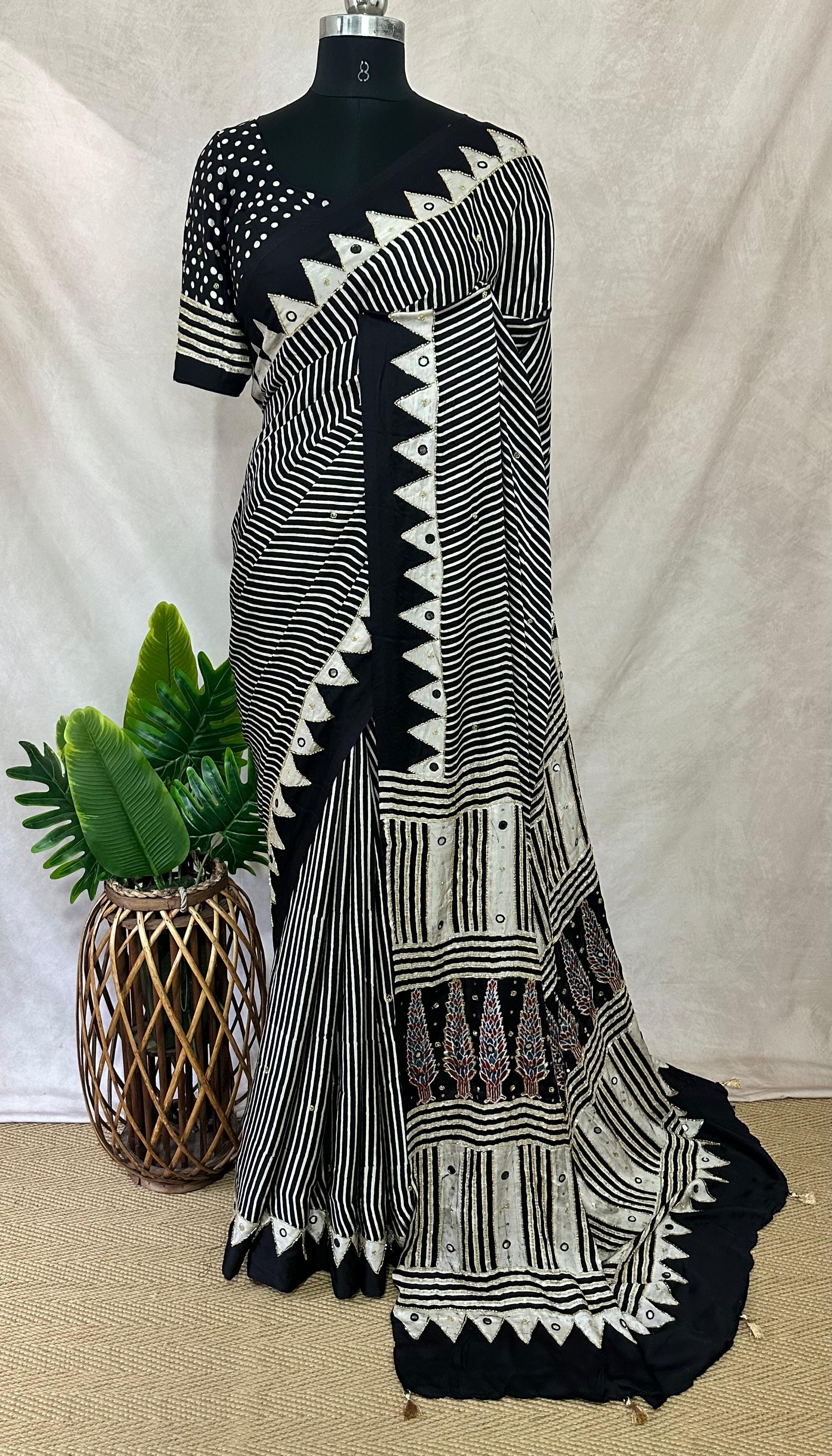 Designer Ajrakh modal silk saree with bead and mirroer handwork, stitched blouse