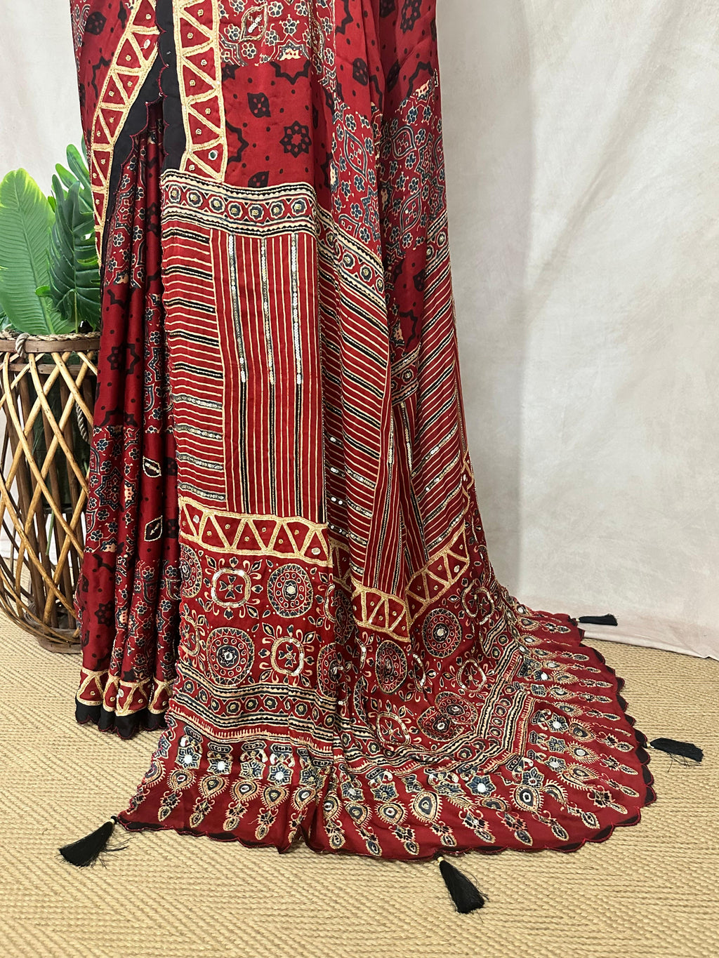 Designer Ajrakh modal silk saree with bead and mirroer handwork, stitched blouse