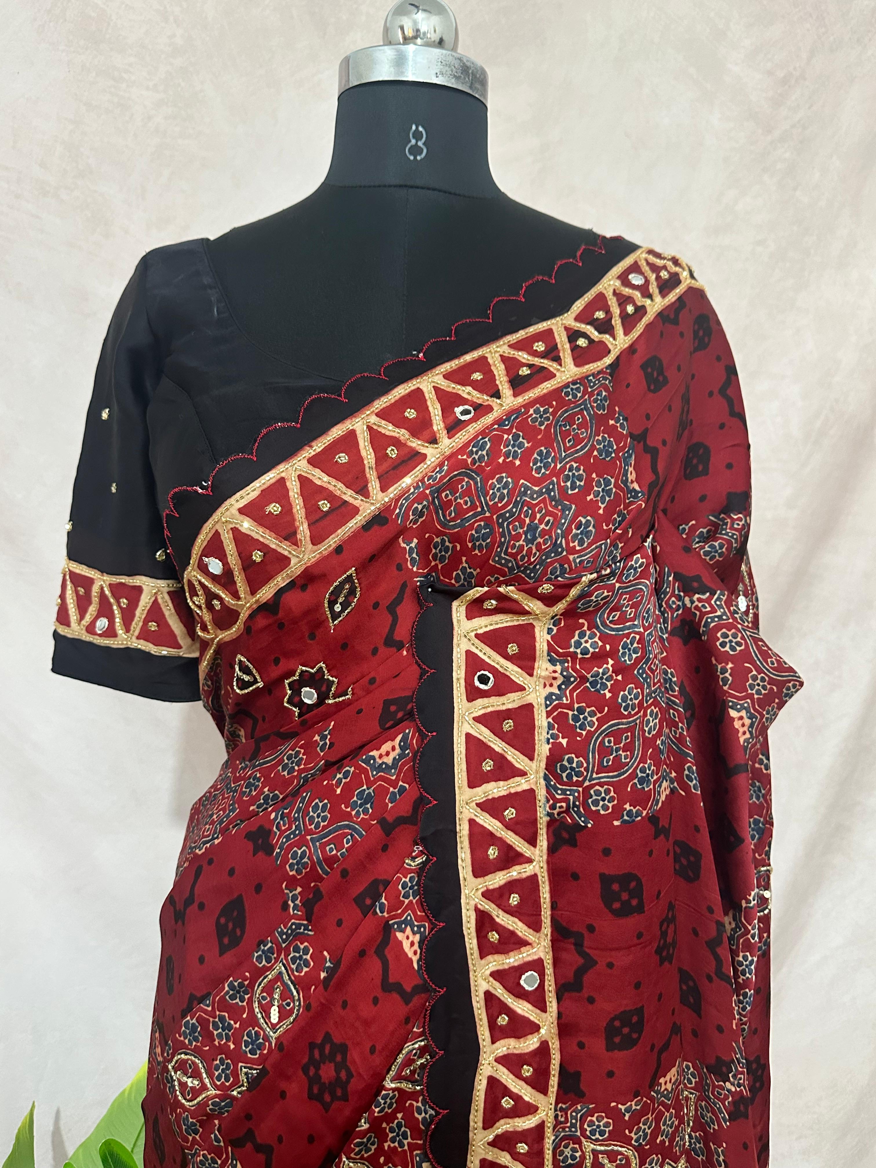 Designer Ajrakh modal silk saree with bead and mirroer handwork, stitched blouse