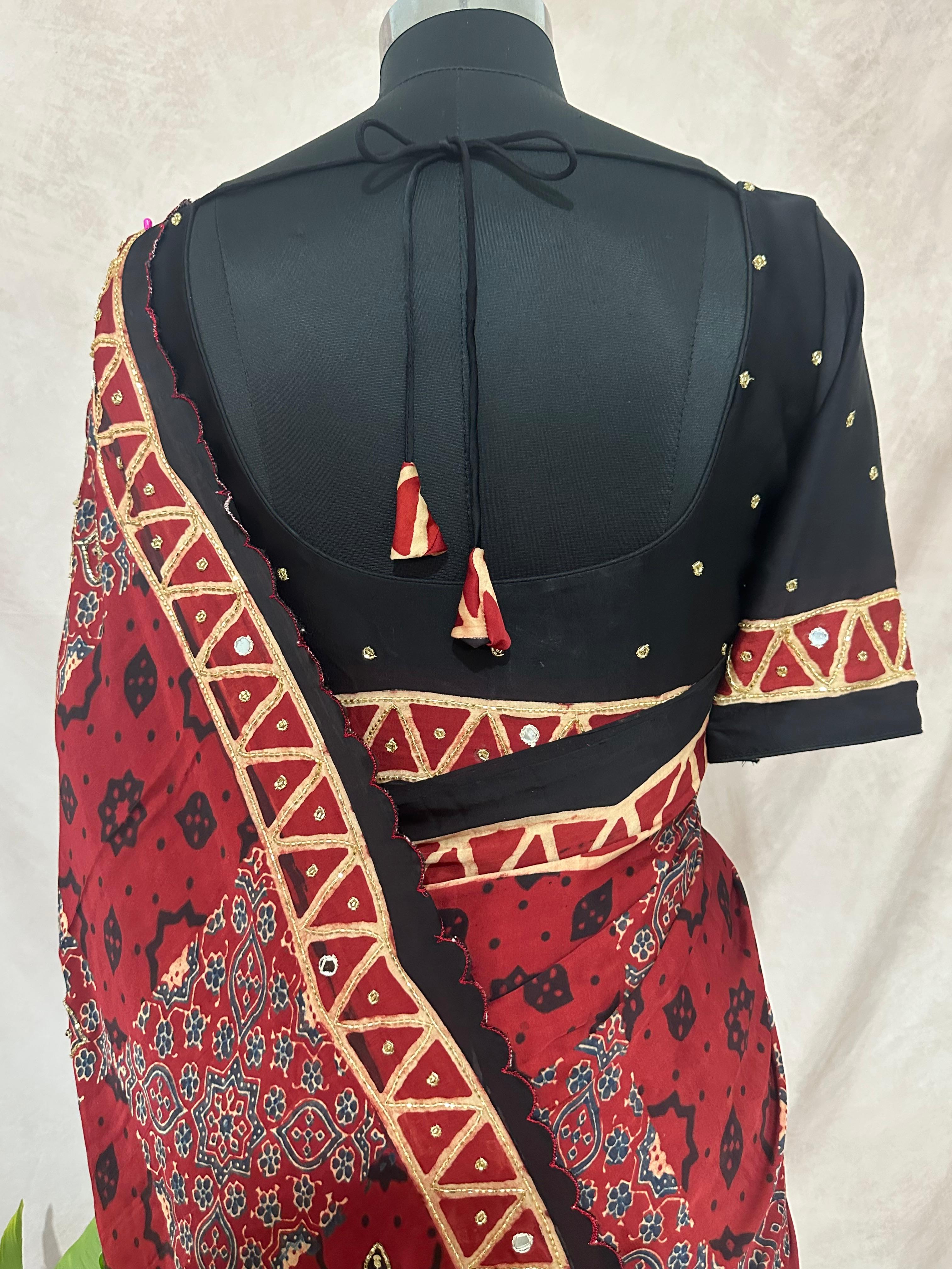 Designer Ajrakh modal silk saree with bead and mirroer handwork, stitched blouse
