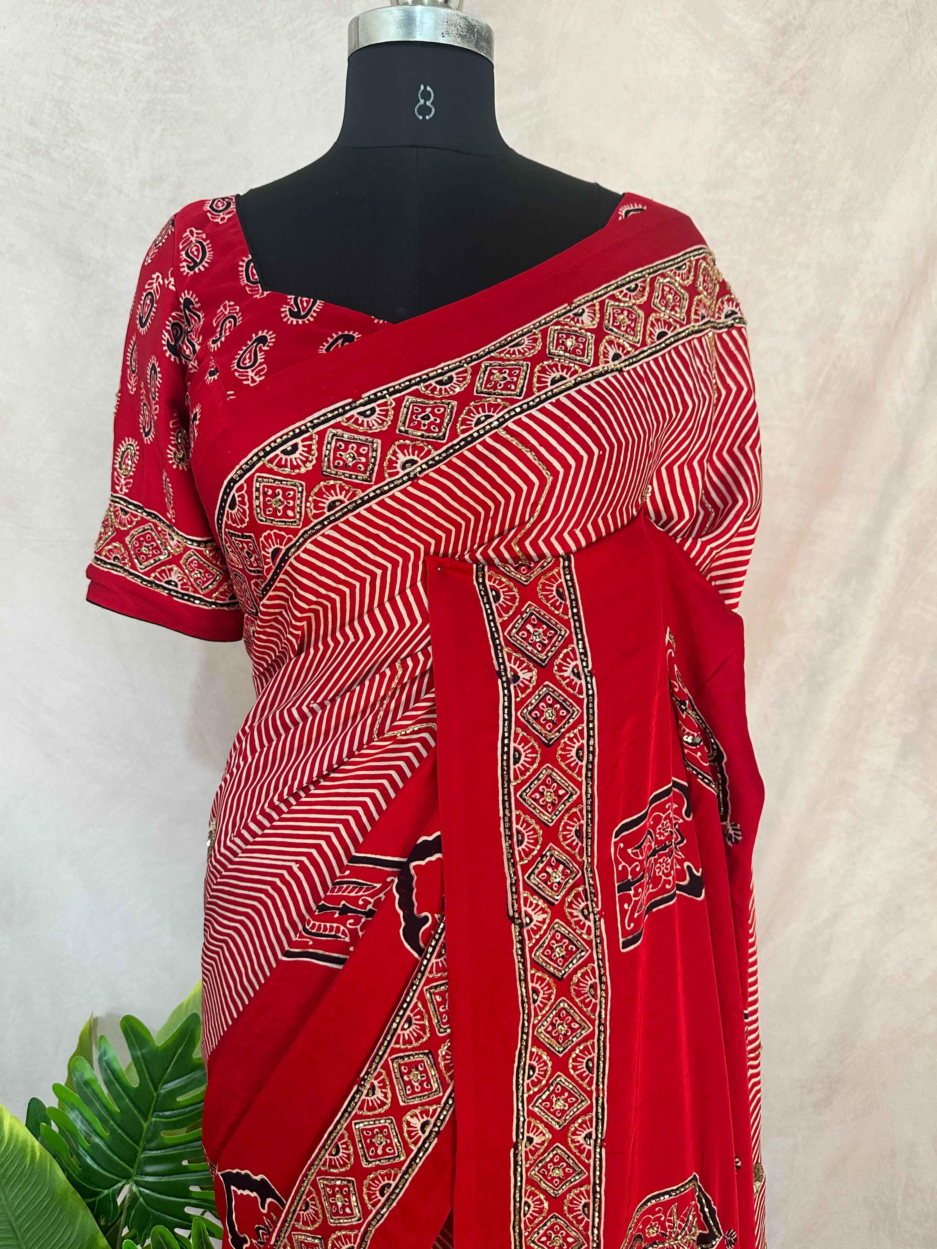 Designer Ajrakh modal silk saree with bead and mirror handwork, stitched blouse