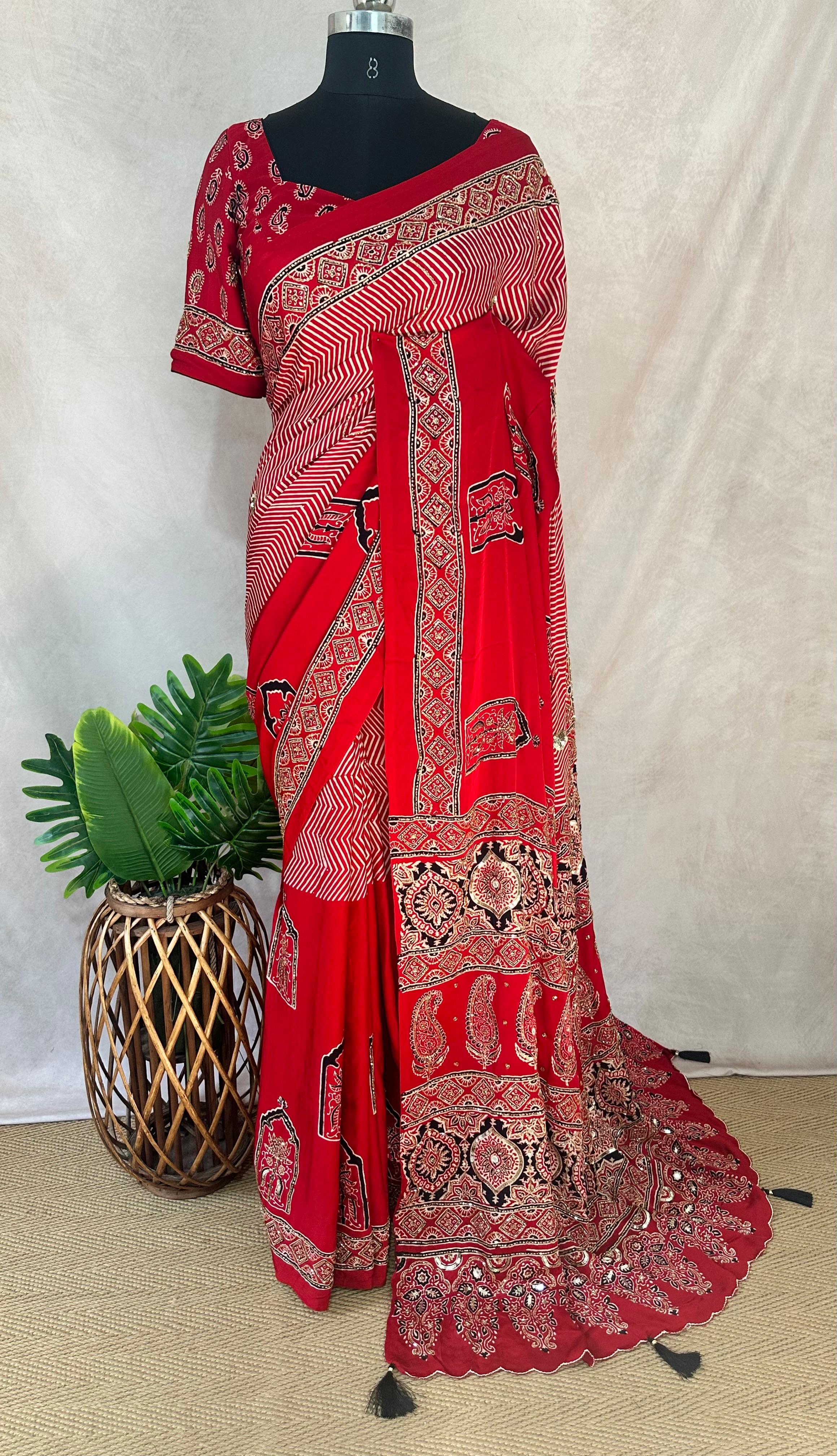 Designer Ajrakh modal silk saree with bead and mirror handwork, stitched blouse
