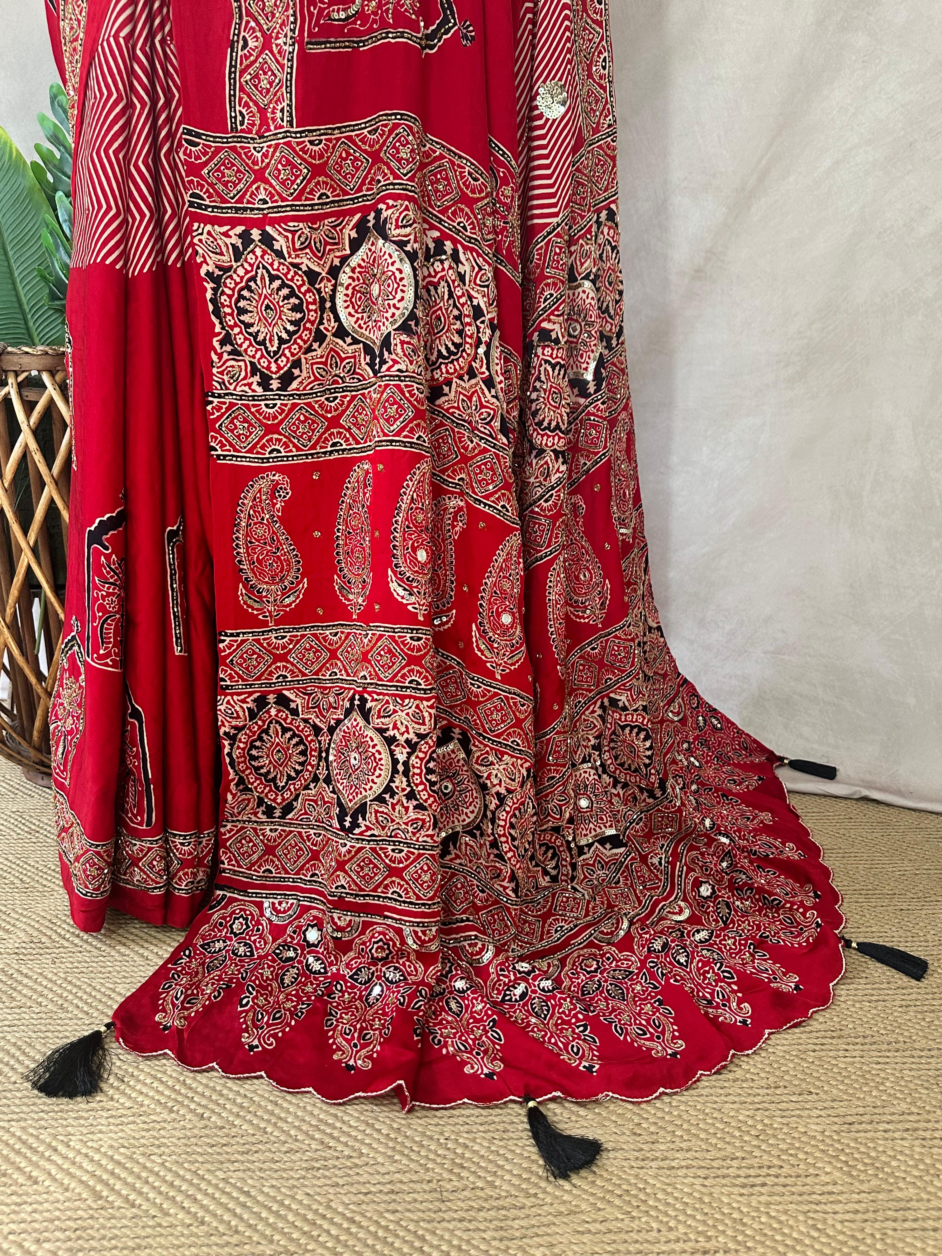 Designer Ajrakh modal silk saree with bead and mirror handwork, stitched blouse