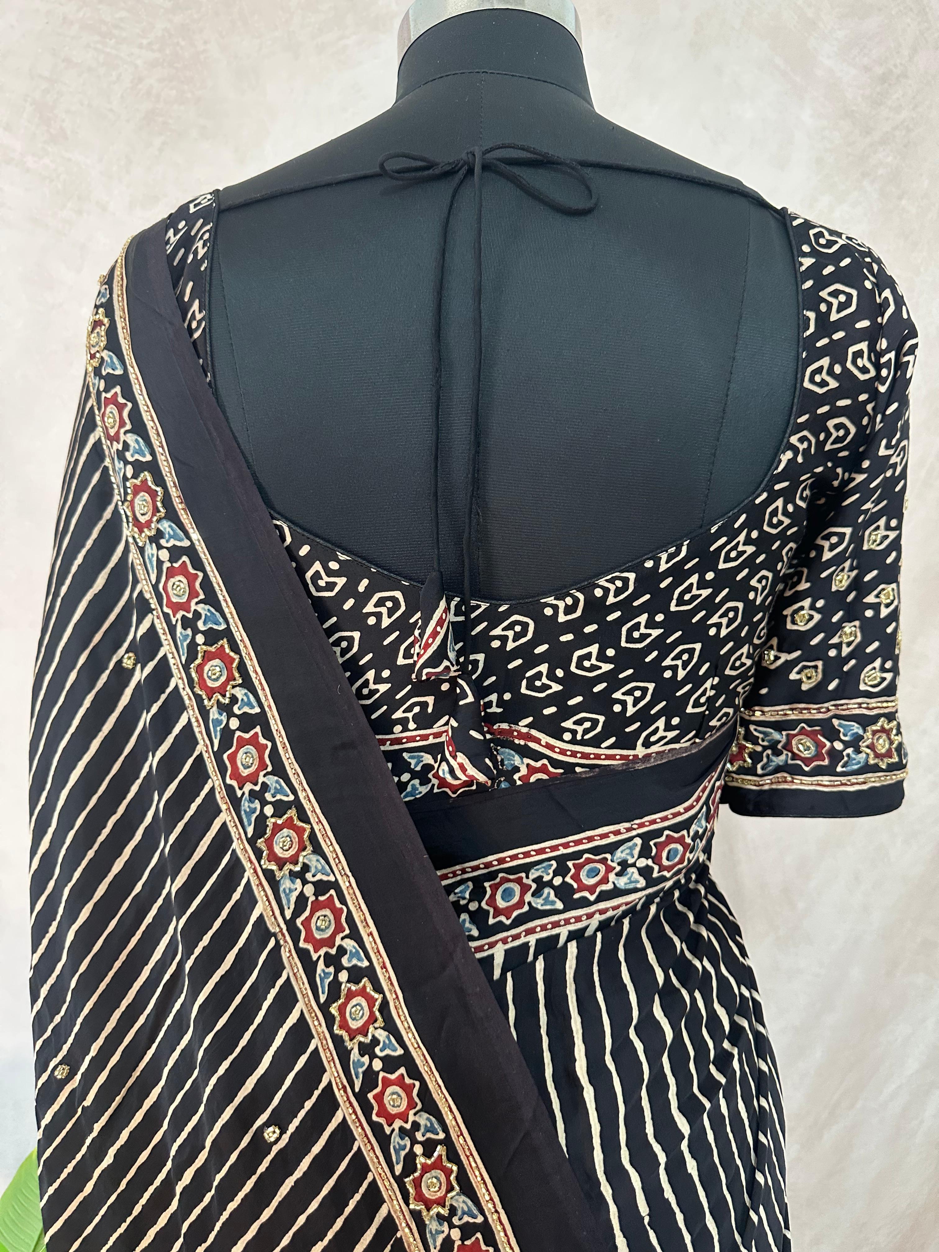 Designer Ajrakh modal silk saree with bead and mirror handwork, stitched blouse