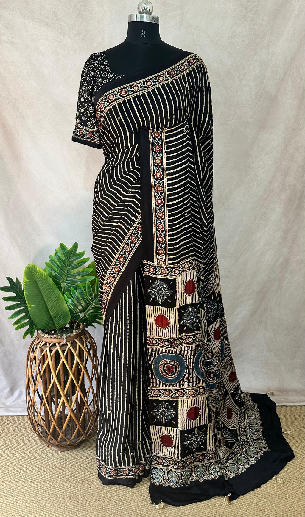 Designer Ajrakh modal silk saree with bead and mirror handwork, stitched blouse