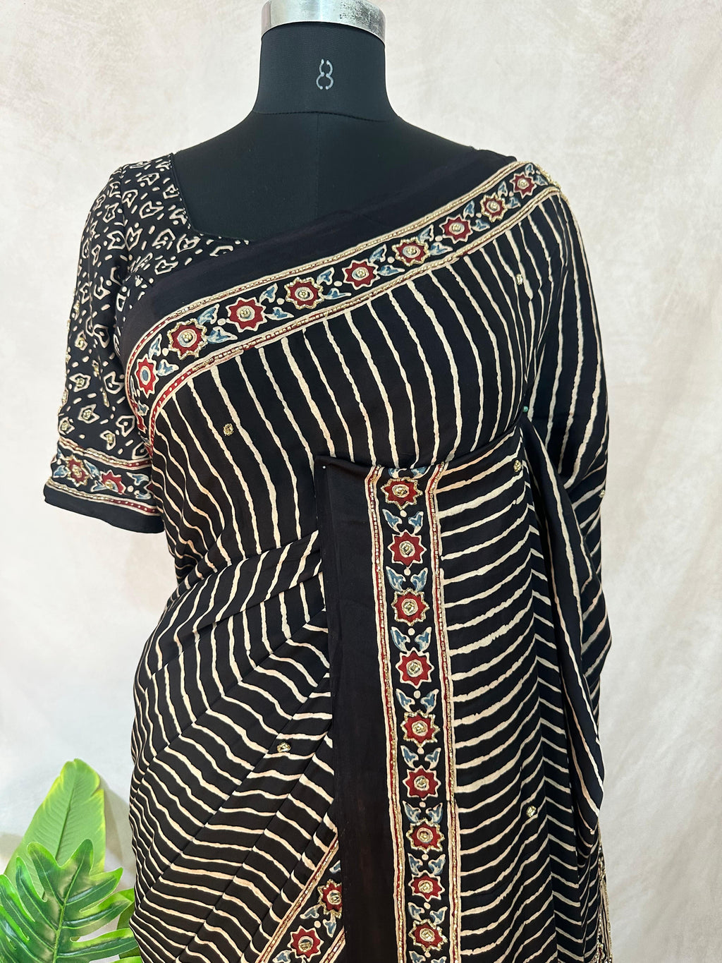 Designer Ajrakh modal silk saree with bead and mirror handwork, stitched blouse