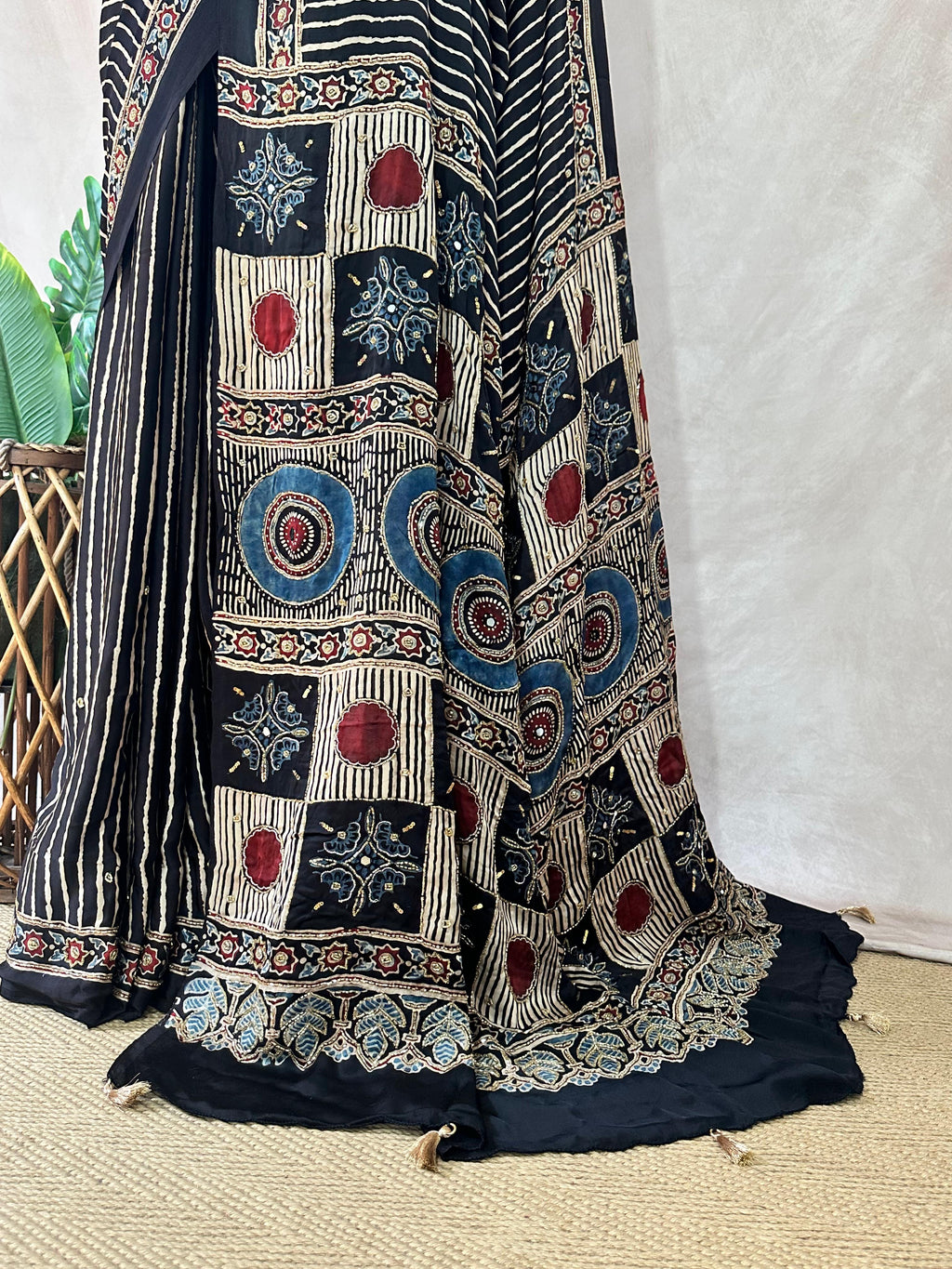 Designer Ajrakh modal silk saree with bead and mirror handwork, stitched blouse