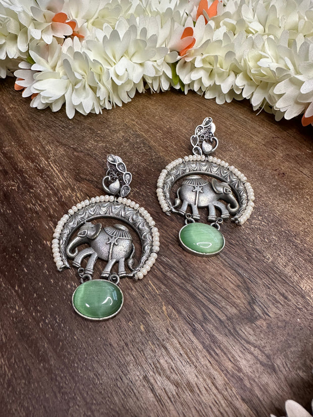 Silver replica with elephant motives and Green semi precious stone
