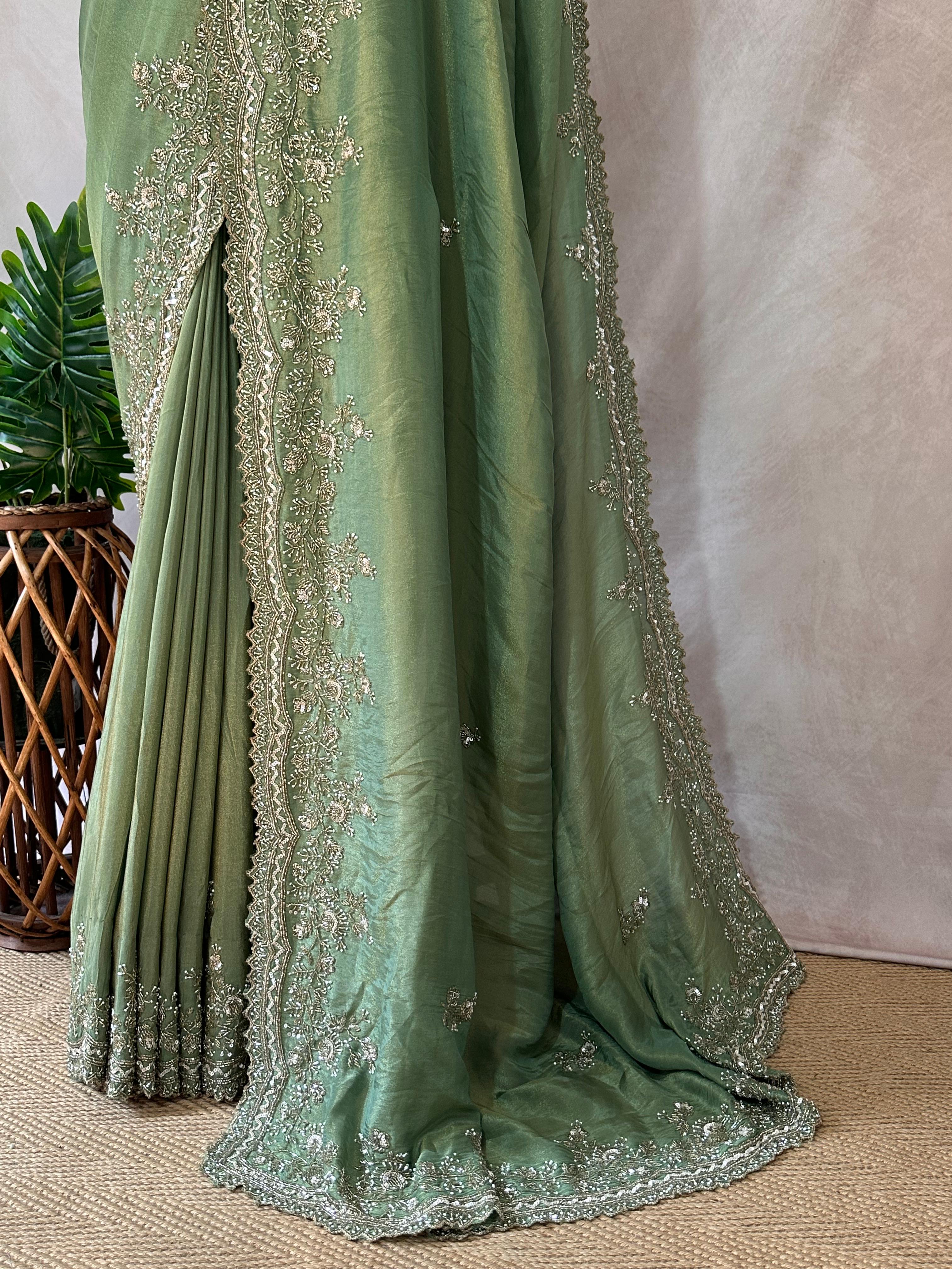 Green tissue designer saree with stitched blouse and under skirt