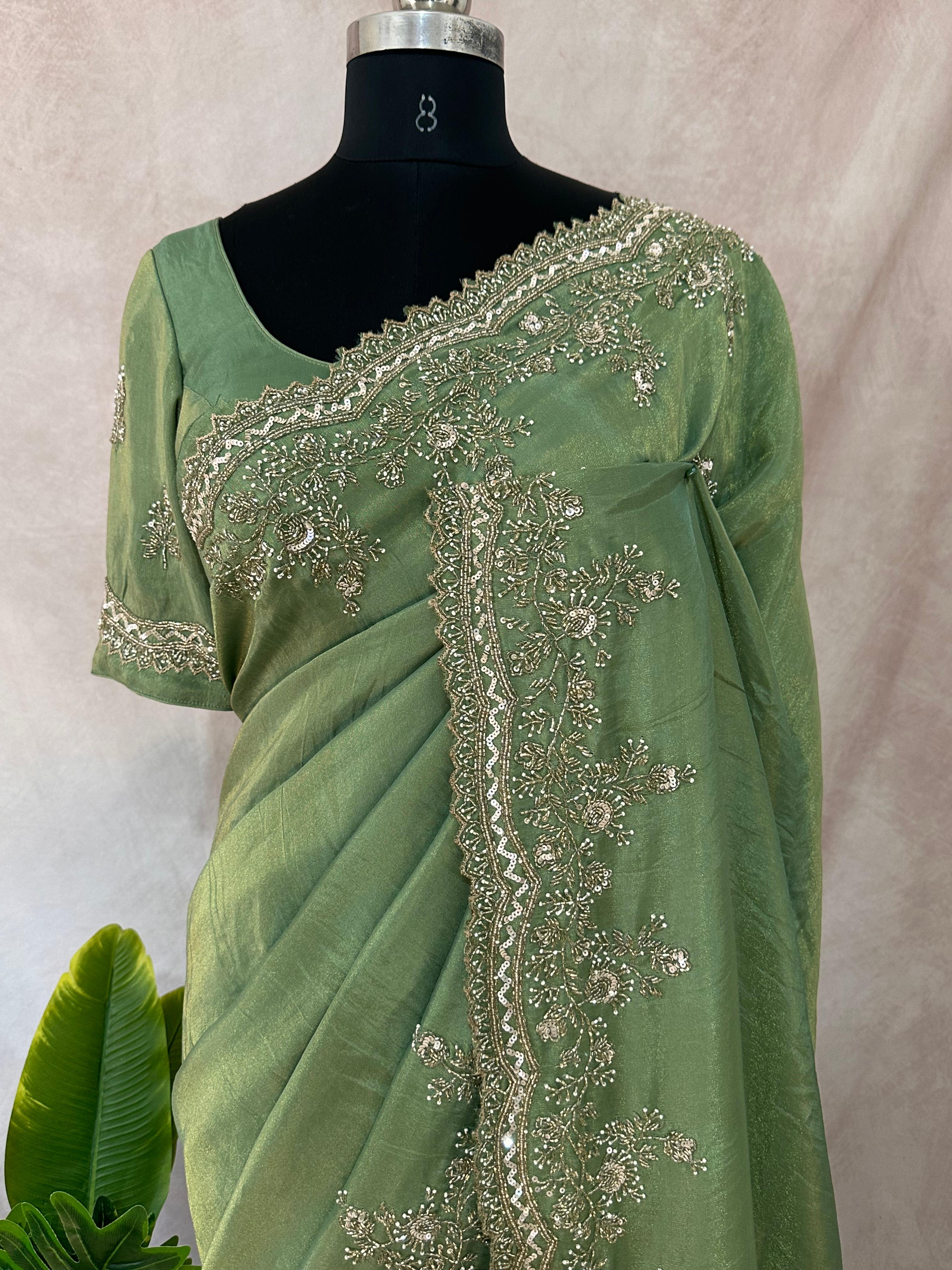 Green tissue designer saree with stitched blouse and under skirt