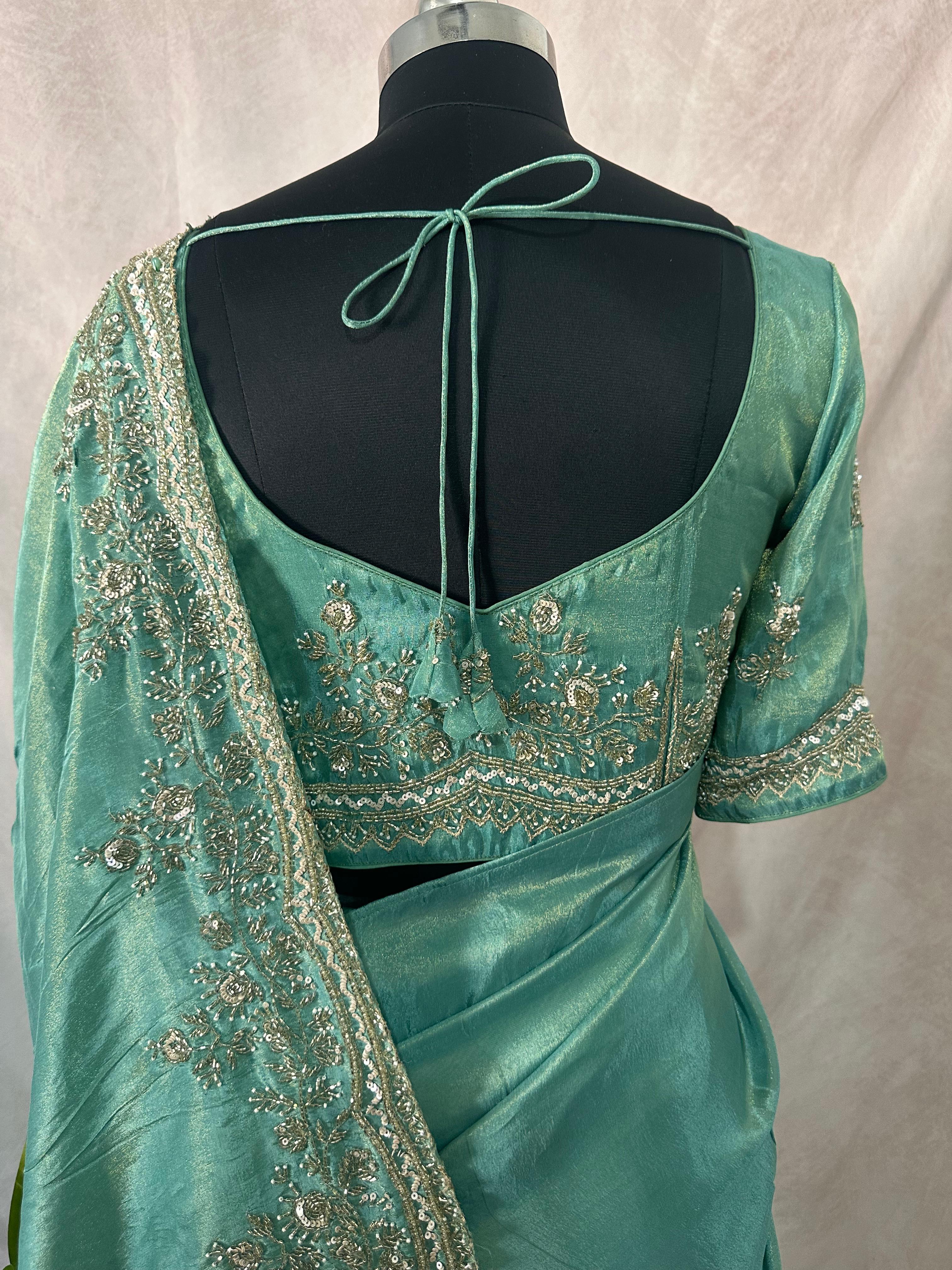 Green tissue designer saree with stitched blouse and under skirt