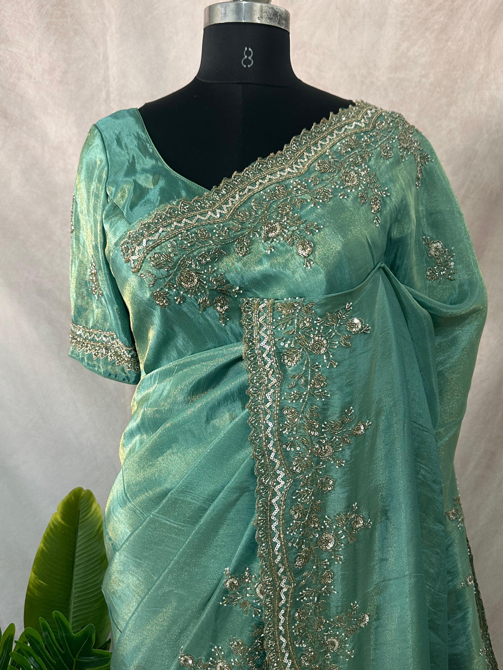 Green tissue designer saree with stitched blouse and under skirt